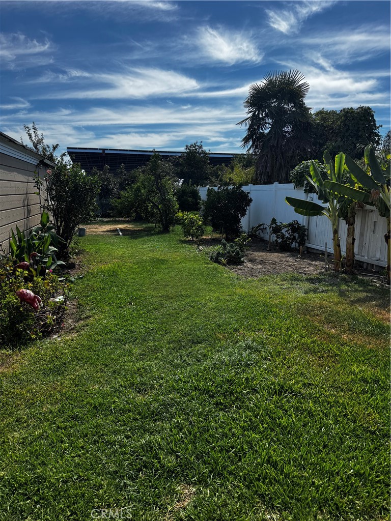Now available for lease—this beautifully upgraded 4-bedroom, 3-bath home offers a spacious and flexible layout in a prime Downey location. The main level includes 2 bedrooms, 2 bathrooms, a formal living room with fireplace, and a dedicated laundry room. Upstairs you'll find a second living area, 2 additional bedrooms, a full bath, and ample built-in storage. The large, landscaped backyard is perfect for entertaining and features mature fruit trees, a detached garage, and a bonus workroom. Conveniently located near schools, shopping centers, restaurants, freeways, and Downey Landing.