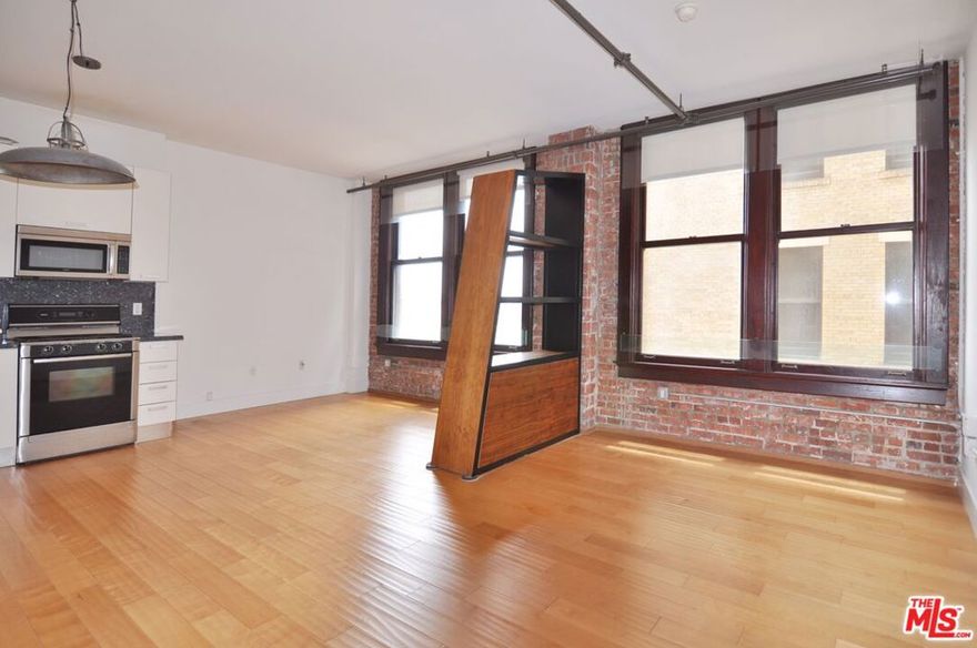 Charming 600sf live/work open plan loft with exposed brick, bright natural east-facing light, and located in the historic Rowan Building. This well-maintained NYC style loft has a flexible floorplan that is ideal for your creative needs. The kitchen is equipped with white Italian Scavolini cabinetry, stainless steel appliances and integrated dishwasher, plus a Bosch washer and dryer in the unit. Spacious bathroom has a deep soaking tub and room for additional storage. There is a large closet with built-in shelving. Amenities include 24/7 front desk security and reception desk that can accept and hold deliveries, outdoor deck that features hot and cold spa pools, resident lounge, BBQs, outdoor dining/lounge area, extra basement storage options. Fantastic location across from the famed Last Book Store, weekly Farmer's Market next to the building, pet friendly Spring Street Park next door, and a few short blocks to Grand Central Mkt, Metro station, Arts District, Little Tokyo, Whole Foods, Grand Park, tons of coffee shops & dining hot spots! Small pets considered with pet deposit. Parking is available in the adjacent covered garage structure for an additional fee.