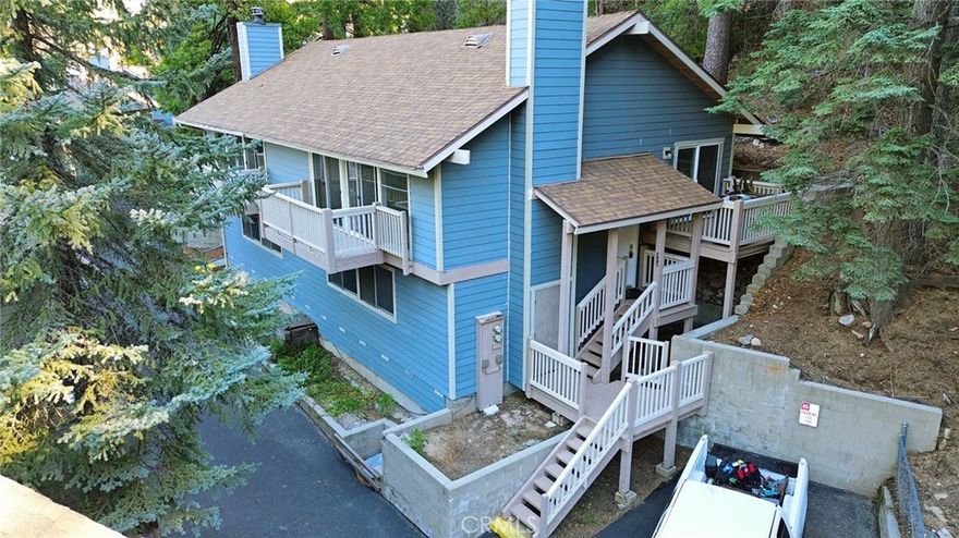 Nestled in the highly sought-after Lake Arrowhead Chalets, this beautifully appointed 3-bedroom, 2-bath condominium offers 1,404 sq ft of refined mountain living within a private, gated community just moments from Lake Arrowhead and the Village.
The spacious open-concept living area is highlighted by soaring vaulted ceilings, a dramatic stone fireplace, and updated flooring, creating a warm yet sophisticated ambiance. Sliding doors lead to a private deck overlooking tranquil forest scenery—perfect for relaxing or entertaining.
The light-filled kitchen features elegant granite countertops, generous cabinetry, and seamless flow into the main living space. The well-designed floor plan provides comfort and functionality for full-time living, weekend getaways, or income-producing use.
Residents enjoy exclusive community amenities including lake access, swimming pool, spa, clubhouse, and assigned parking, all within a serene alpine setting.
A rare opportunity to own in one of Lake Arrowhead’s most desirable communities—offering lifestyle, location, and long-term value.