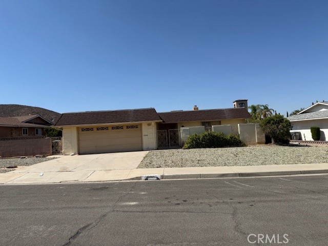 This 3 bedroom, 2 bathroom home has a wonderful flowing floorplan with a double-door entry and is one of the more desirable, larger floorplans in this area. It features a private courtyard with access from the formal living area and a sunroom for relaxing and security windows and doors throughout. Large kitchen with beautiful glass front cabinets is open to the dining area and casual living room with fireplace, convenient for entertaining. There are several sliding glass doors to the outdoor patios, sunroom and front courtyard. Most of the landscaping is low-maintenance with mature foilage too. This home is also located near all amenities and a local hospital with easy access to major freeway, shopping and restaurants.