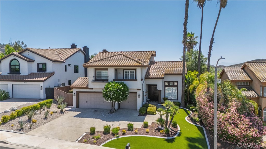 Welcome to this 4B/R 3 bath former model home, offering 2,757 sq ft of thoughtfully designed living space on a spacious 0.35 acre lot, located on a quiet street with no rear neighbors, the property backs to a natural ravine.providing privacy and panoramic sunrise and moonrise views.upgraded with fresh exterior paint, recessed lighting throughout, new carpet upstairs and plantation shutter blinds on all windows, adding to its fresh, modern and refined appeal. Inside the kitchen comes with fully equipped with a built-in refrigerator, double oven, dishwasher and a Viking wine fridge . Downstairs B/R with a full bath makes an ideal guest suitor in-law quarters. the upstairs features a spacious primary suite with an en-suite bathroom, along with two additional B/R each offering private access to a front balcony perfect for enjoying stunning pink sunsets, includes a bonus room perfect for a playroom, game room or hobby space.Step outside to your own private retreat featuring a pool and spa with solar and gas heating, a putting green, a covered outdoor BBQ area, a build-in gas firepit, and outdoor surround sound speakers to entertain guest in style. 3 car garage with an EV charging outlet and low-maintenance artificial turf in both the front and back yard helping save on water and landscaping costs. the property combines luxury, privacy, comfort and functionality ready for you to move in and enjoy.
