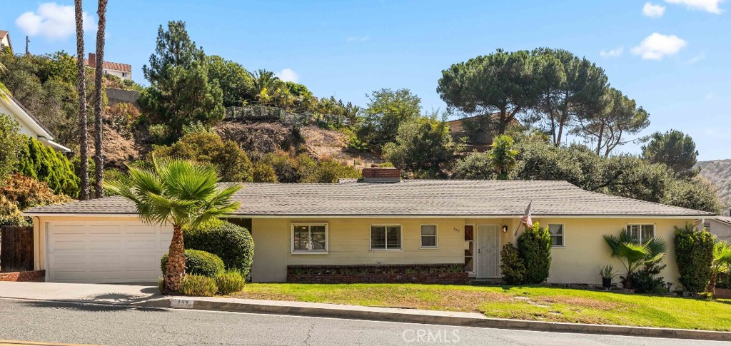 Located in the peaceful hills of Glendale, this 4-bedroom, 1.75-bath home offers 1,711 sq ft of living space on a spacious lot. Features include a drive-through garage with convenient access to the backyard, a private pool, and a covered patio—ideal for outdoor entertaining or relaxing. Situated in a quiet neighborhood, this property presents a fantastic opportunity for buyers looking to personalize and create their dream home in a prime location. Don’t miss the opportunity to make this beautiful property your home!