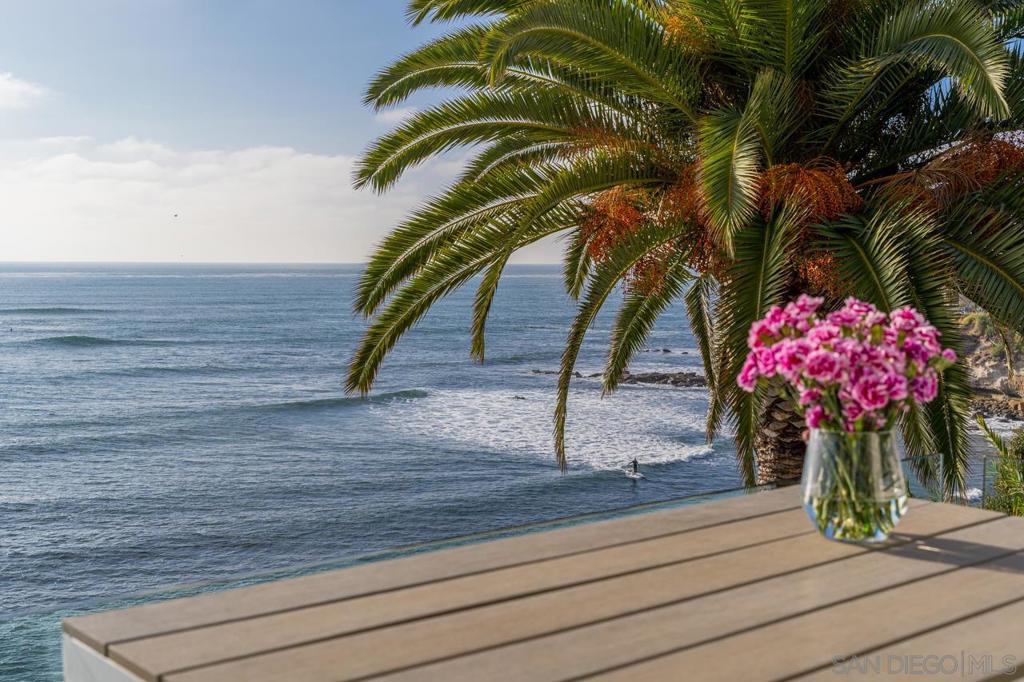 ***600k Meaningful Price Reduction*** Front Row! Best quality & value OCEANFRONT home in SO CAL, located on the prestigious “Street of Dreams”. Enter this Sophisticated & Timeless CONTEMPORARY home through Private Gates to 5,139 sf. A Smart home with 22 ft dramatic entry. Open Floor plan with L/R, D/R, Gourmet Chefs Kitchen w/unobstructed views of Cove & white water waves. Captivating Beauty that only the front row can offer. Use the elevator or elegant grand staircase to the glamourous Primary Suite w/ the European Bathroom of your dreams & w/ ocean views. A rare infinity Oceanfront Pool. Breathe clean ocean air, enjoy sunsets, & experience nature at its finest. Walk the coastline to the village along the most beautiful streets in La Jolla. Pinnacle of Luxury! Optional storage room, Gym, Office or Wine Room. 22 foot high entryway with glass dome leads to open entertaining area with Livingroom, dining room, gourmet kitchen with 18 foot long waterfall island and large patio with jaw dropping ocean views. Designer bathrooms with European Vanities. Exquisite one of a kind primary suite and bath featuring a spacious double glass shower with ocean front views. Elevator to 3 levels with 2 laundry rooms and great family room with wet bar leading to ocean front pool. Extra storage room. Super prime location that is walking distance to Village. Meaniful Remodel and Update done on home in 2016. Equipment: Garage Door Opener,Pool/Spa/Equipment Sewer: Sewer Connected, Public Sewer Frontage: Ocean/Bluff, Open Space