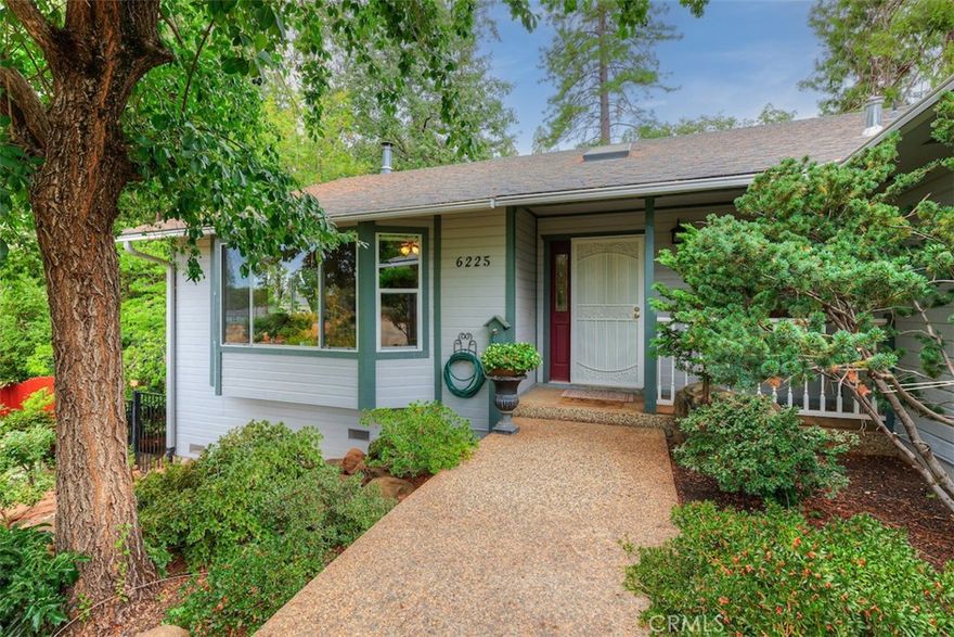 Beautiful, Comfortable & Well-Cared-For Home in Magalia!  Tucked away at the end of a quiet cul-de-sac, this beautiful custom home has been lightly lived in and lovingly maintained. The warm, open floor plan welcomes you in with a spacious living room, large windows that capture the surrounding forest views, and a charming free-standing wood stove...perfect for cozy evenings.  The dining area flows easily into the spacious kitchen, which showcases several cabinets, granite countertops, and nice appliances. The bedrooms are roomy, and the generous primary suite offers direct access to the expansive composite deck overlooking the serene backyard.  This property is beautifully landscaped front and back, complete with a koi pond, lush greenery, and a striking rock waterfall that creates a peaceful ambiance. Enjoy plenty of under-house storage, window blinds and treatments, mirrored closet doors, ceiling fans in most rooms, and other thoughtful details throughout.  Backs to the greenbelt, offering added privacy and the enjoyment of all nature has to offer right from your own yard. A truly special home ready for its next chapter!