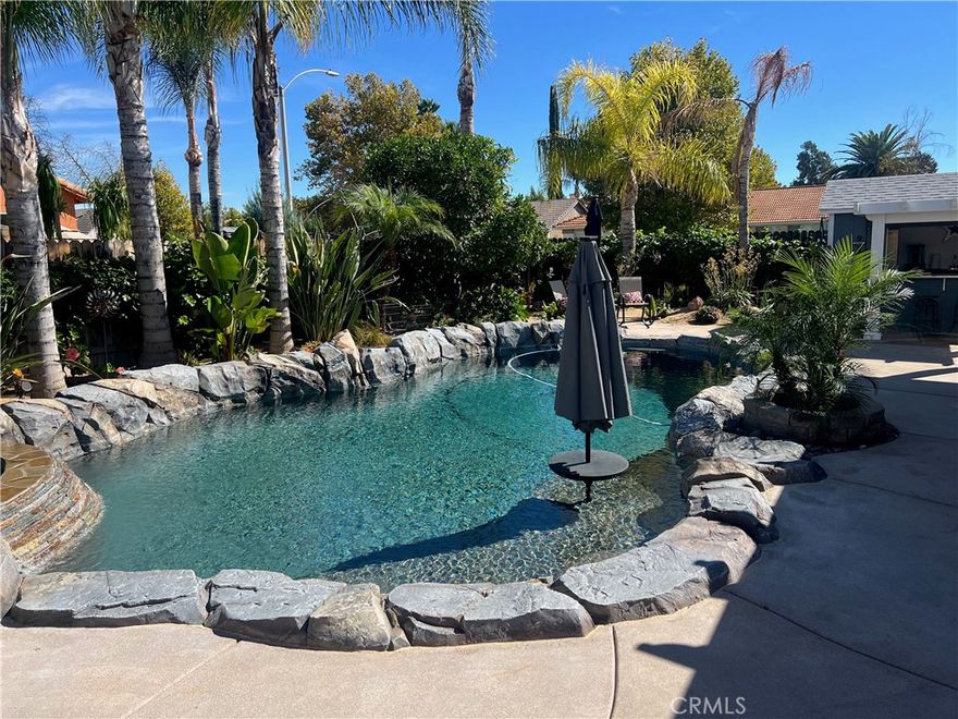 Charming Corner Single-Story in Menifee with Stunning Outdoor Living!

This beautifully remodeled 3-bedroom, 2-bath home perfectly blends indoor comfort with resort-style outdoor living. Thoughtfully updated in 2020, the seller has truly checked all the boxes—inside and out.

Enjoy a private backyard oasis featuring a Pebble Tec saltwater pool, converted shed turned outdoor cabana, Sonance sound system, and custom lighting. The professionally designed landscaping offers desert-style appeal in the front and a tropical retreat in the back. Additional upgrades include new fencing, rain gutters, a 30-foot patio cover with patio furniture, and an expanded front driveway with brick inlay.

Step inside to find newer vinyl plank flooring with 6-inch baseboards, plantation shutters throughout, granite counters, a custom stone kitchen backsplash, and new bathroom vanities. The primary suite includes custom wardrobe shelving, while all bedrooms feature mirrored closet doors. Other touches include a hallway linen cabinet and a new garage door that enhances both function and curb appeal.

This home delivers effortless indoor-outdoor living with every detail thoughtfully designed for comfort, style, and entertaining. Low taxes and No Hoa. Professional photos coming soon.