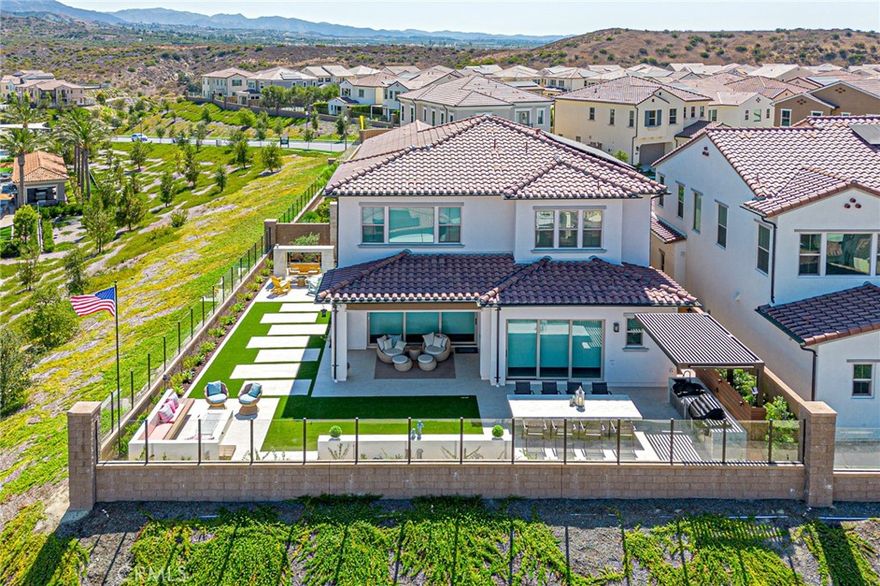The Most Breathtaking View in Irvine
Discover an exceptional 4-bedroom, 4.5-bathroom residence located in the highly sought-after Portola Springs community of Irvine. Designed for both elegance and comfort, each bedroom is a private en-suite, offering ultimate privacy for family members and guests alike.
The open-concept main level welcomes you with a sun-filled great room and a chef-inspired kitchen featuring quartz countertops, premium stainless steel appliances, and an oversized center island perfect for gatherings and entertaining. Step outside to a private balcony where sweeping mountain and city views stretch endlessly before you—the most stunning panorama you will find in Irvine. Whether enjoying your morning coffee or winding down with an evening glass of wine, this outdoor retreat elevates every moment.
Upstairs, a spacious loft offers versatile use as a secondary living area, home office, or playroom. The primary suite is a true sanctuary, highlighted by an airy layout, walk-in closet, and a spa-like bathroom with both a soaking tub and glass-enclosed shower.
Additional upgrades include designer flooring, recessed lighting, a convenient upstairs laundry room, and a low-maintenance backyard. The community of Portola Springs enhances the lifestyle with resort-style amenities—multiple pools, parks, hiking trails, sports courts, and access to Irvine’s top-rated schools. Easy access to freeways, shopping, and dining ensures convenience at every turn.
This is more than a home—it’s a rare opportunity to own the most beautiful view home in Irvine.
