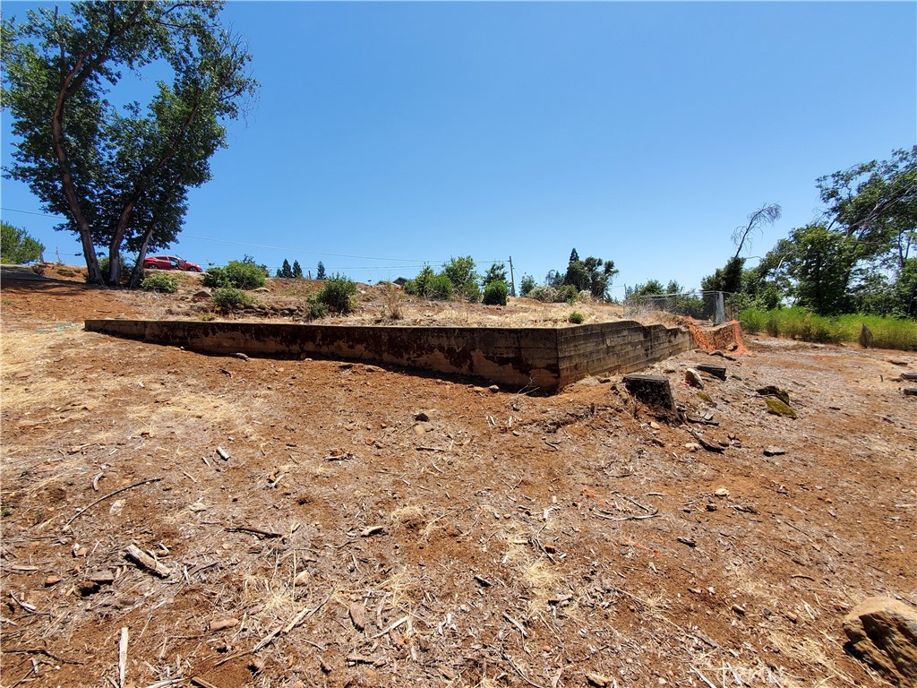 Welcome to 2190 De Mille Road - where opportunity meets tranquility in the heart of Paradise.
This generous 2.11 acre lot offers a rare chance to build your dream home amid the natural beauty of the Sierra foothills. The property features a slightly sloped terrain, ideal for capturing beautiful views of nature and offering versatile building potential. Tucked away on a quiet, established street just minutes from Skyway, it offers privacy, peaceful surroundings, and a connection to nature - while still being close to schools, shopping, and town amenities. Whether you're envisioning a custom retreat or an investment in the growing Paradise community, this property is rich with potential. Additionally, the location is ideal for those seeking both quiet living and convenience. Come walk the land, take in the views, and imagine the possibilities. Rebuilding Paradise starts here. Your future starts here.