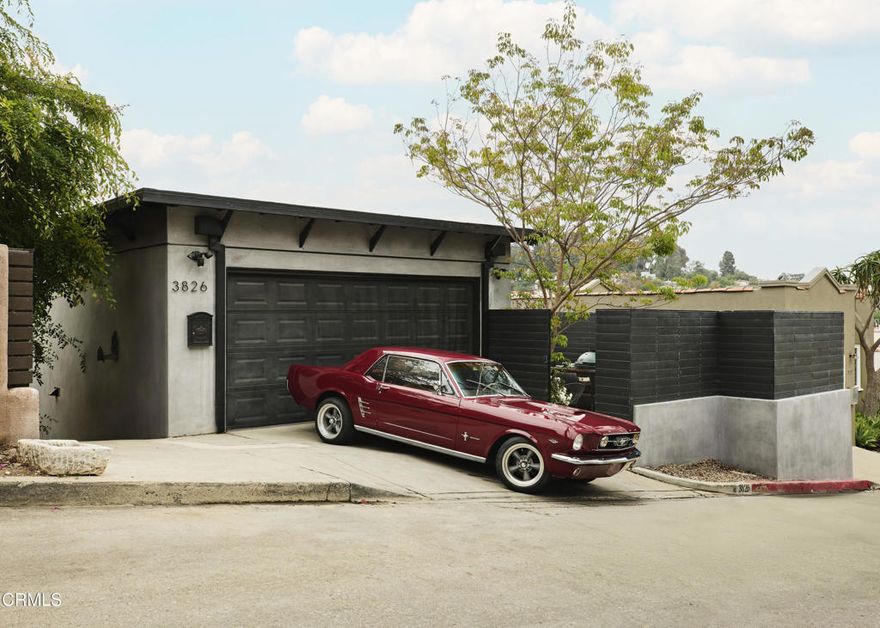 Perched in the Franklin Hills, this updated home offers views, style, and flexibility. The main level features an open living room with fireplace,powder bath, updated kitchen, dining area, and direct access from the 2-car garage--plus laundry in the garage for easy flow. Just off the dining area, a balcony opens to sweeping views of the hills, downtown, and lush green surroundings.The lower level holds all three bedrooms and two baths, with the primary suite opening to its own private balcony with similar views of the skyline and nature.Down a separate entrance, a finished creative space with its own landing makes the perfect studio, office, or client meeting zone--separate from home life but still connected.Out front, a gated and private courtyard wraps around a built-in natural gas fire pit--an ideal space for BBQing, relaxing, and hosting under the stars.Renovated in 2020/2021, the home includes updated systems, appliances, a whole-house fire suppression system, and built-in speakers inside and out.Located in a quiet pocket filled with creatives, founders, and artists--just a 10-minute walk to Sunset Junction and close to Erewhon, Tartine, Intelligentsia, and all the neighborhood favorites.