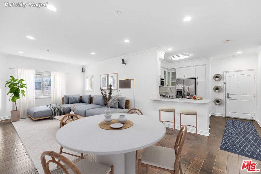 Dearest Readers, It has come to my attention that a most intriguing residence has emerged upon the market in the ever-charming Studio City. A home not of mere utility, but of taste, style, and the faintest whisper of grandeur.This 3-bedroom, 2.5-bath condo spans an impressive 1,390 square feet, offering a floor plan most suited to both lively entertaining and quiet retreat. One is immediately greeted by gleaming hardwood floors, crisp white walls, and a fireplace that practically begs for whispered secrets and scandalous storytelling. The kitchen, with its marble-veined counters, stainless steel appliances, and glass-front cabinets, suggests that even the most modest meal will feel rather regal. Down the hall, a pair of full baths, each generously proportioned, promise to settle any domestic quarrel over morning routines. The primary suite is a retreat unto itself, offering space and elegance, while two additional bedrooms may serve as chambers for family, guests, or those who wish to fashion a most enviable study.Not to be overlooked, this residence boasts tandem parking for two vehicles and, most enticing of all, a separate private outdoor space. Though not directly attached, it is securely gated, a perfect hideaway for evening soirees or morning tea. The practical among us will be relieved to learn that water and trash are included, whilst pets, if accompanied by a modest deposit, are graciously considered. All of this, dear reader, for the sum of $4,295 per month.It would be most unwise to tarry. For a home such as this, suitors are sure to line up with haste.Yours most sincerely, The Rental Girl