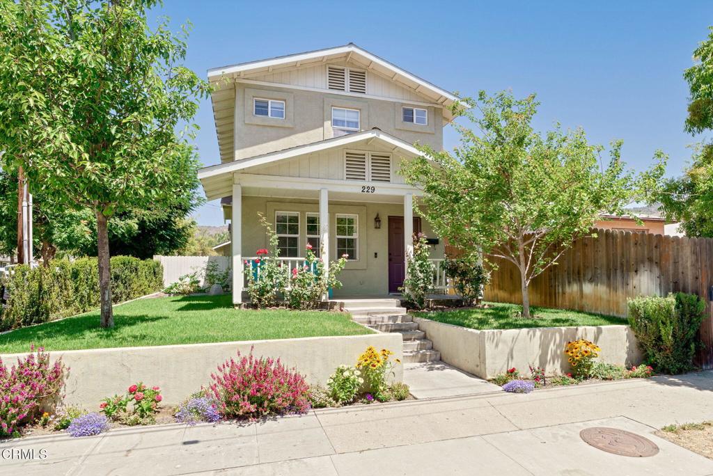 Situated on a beautiful corner lot, this thoughtfully upgraded 3 bedroom, 2.5 bath home offers refined comfort and timeless curb appeal. An enclosed and separate downstairs BONUS room is currently used as a dining room, but could also be a wonderful office, playroom, or guest accommodations. A classic front porch sets the tone, leading into a light-filled interior featuring a modernized kitchen, upstairs laundry, and a host of functional and aesthetic enhancements throughout. Enjoy year-round efficiency (and monthly savings!) with a paid-off solar panel system, central A/C, a newer HVAC system (installed less than 2 years ago), and a water heater replaced within the past year. The property offers mature fruit trees, a vegetable garden, potential dog run, and direct access to a 2-car garage via the rear alley--blending convenience with charm in one complete package. **Best of all: NO HOA** Homes with this level of care, character, and value don't come along every day. Schedule a showing and see why this house could be 'More than just a Home -- A Place To Grow'.
