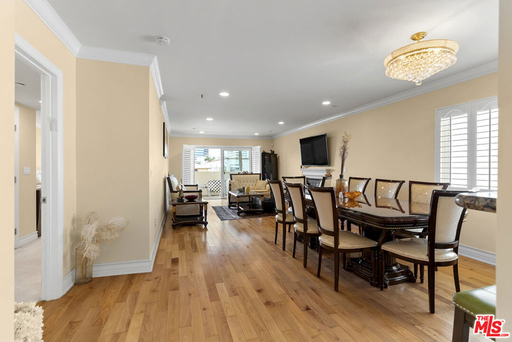 Welcome to Armacost Chateau, a luxurious 3BD/3BA condo located in the heart of the Westside. This bright and spacious front-facing unit offers approx. 1,644 sq ft of refined living with an open-concept layout perfect for entertaining. Ideally located, fresh ocean air pours in with no obstruction being positioned in the front of the building. Curate your favorite bites, featuring a chef's kitchen with oversized countertops, custom cabinetry, and stainless steel appliances. Enjoy conversations with family & friends as the open floor plan flows from the kitchen through the dining and living areas. The expansive living room features a gas fireplace, hardwood floors, recessed lighting, and access to a private balcony with tree-lined street views. The generous primary suite boasts two walk-in closets and a spa-inspired bath with dual vanities, separate tub, and shower. Two additional bedrooms with built-in storage offer flexibility for office or guest use. Other highlights include a powder room, in-unit laundry, central HVAC, double-pane windows, and plantation shutters throughout. This compound is access-controlled at every entry point including the elevator. The private gated garage comes with assigned two-car parking, ample guest spaces & additional storage. Ideally located just off Wilshire Blvd near Sawtelle Japantown, Brentwood, Westwood, Santa Monica, UCLA, and the 405. Rare opportunity to own a turnkey, move-in-ready residence in a prime Westside location.