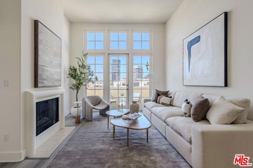 Welcome to this bright and spacious Penthouse condo in the heart of Los Angeles. This two-bedroom, two-bathroom home features high vaulted ceilings and expansive windows with incredible city views. The open floor plan includes a comfortable living area with a gas fireplace, an open kitchen with stainless steel appliances, breakfast bar, and plenty of cabinet space. The large primary suite has a walk-in closet and an en-suite bathroom with double sinks and a soaking tub. The second bedroom is generously sized and features an en-suite bathroom and ample closet space. Step out onto your private balcony and take in the panoramic views perfect for morning coffee or evening get-togethers. Located just minutes from Sawtelle Japantown, Brentwood, and Santa Monica, you'll enjoy easy access to restaurants, shops, freeways, and the beach. The building features a secure entrance and gated garage, along with in-unit laundry. Don't miss this stunning penthouse schedule your private tour today.