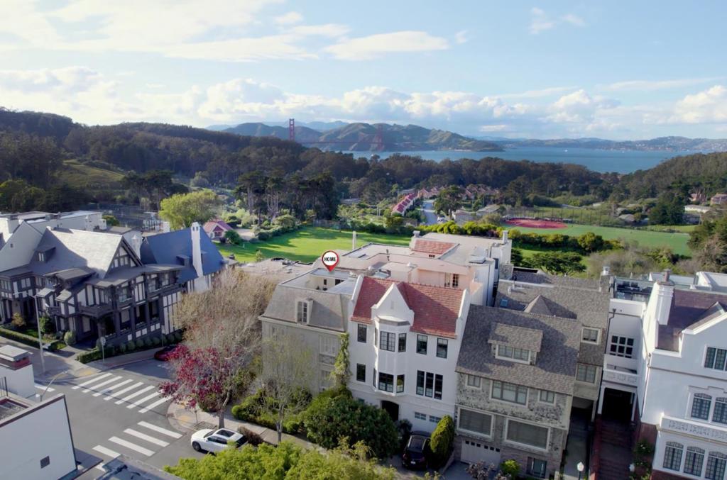 Magnificent & Luxurious! This rare, spectacular home is located in the prestigious Presidio Heights neighborhood. Offering billion-dollar views inside & out; views of both the SF Bay & Golden Gate Bridge. This luxurious San Francisco home is situated on a coveted corner lot, just steps from The Presidio, a cherished national park w/ lush greenery, recreational opportunities, & scenic overlooks. Nearby attractions include Crissy Field, Palace of Fine Arts, & Baker Beach. The estate boasts elegant French-style architecture w/ a Mansard roof, wrought-iron balconies, & towering windows. Inside, the open floor plan is bathed in natural light, featuring spacious living quarters, a large kitchen, multiple en-suite bedrooms, a gym, a walk-in safe, an elevator, a formal dining room, spa-like bathrooms, a grand living room, family room, unique fireplaces, a study, & a caretakers apartment. The home also offers a generous backyard, multiple balconies, open rooftop patio, and a car lift w/ parking for up to four cars. This magnificent estate epitomizes sophisticated urban living and provides an unrivaled San Francisco lifestyle. You will feel grand and opulent in this one-of-a-kind home, which must be seen to be truly appreciate, pictures can't capture its full beauty! Hurry, don't miss out!