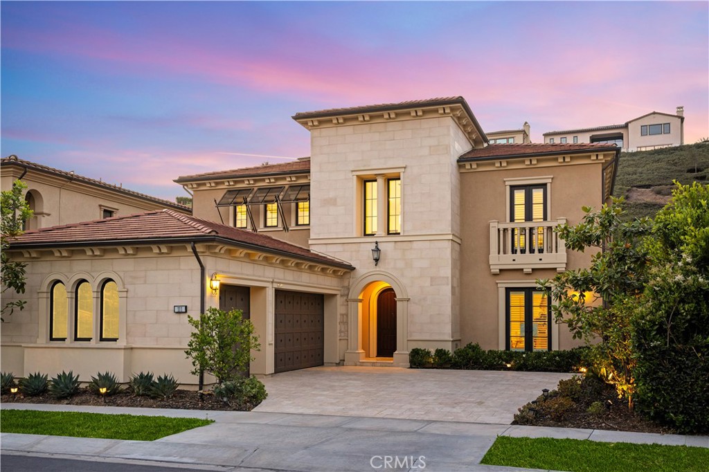 Sited in one of Irvine’s most prestigious communities, this beautifully designed home offers a seamless blend of luxury, functionality, and privacy. Set on a quiet street within the 24-hour guard-gated Groves of Orchard Hills, the property enjoys access to top-rated schools and exclusive resort-style amenities including a pool, clubhouse, tennis courts, scenic parks, hiking trails, and year-round community events.
Upon entering, you’re welcomed by an impressive grand foyer with soaring ceilings, a statement spiral staircase, and an elegant chandelier, all setting a refined yet modern tone. The expansive layout includes a large, light-filled loft with recessed lighting and windows—ideal for a second living area or creative space.
Designed with both everyday living and entertaining in mind, the home features a flex office space, two separate garages, and a chef-caliber kitchen complete with a walk-in pantry, prep kitchen, oversized island with breakfast bar, and premium stainless steel appliances.
The primary suite boasts a luxuriously updated walk-in closet and a spa-inspired bath with a large all-glass steam shower, soaking tub, and expansive his-and-her vanities. Updated flooring and crisp white walls throughout the home enhance its brightness and clean elegance.
The private backyard offers a peaceful retreat, while every detail in the home— including added square footage and designer finishes—reflects thoughtful upgrades and modern design.
A rare opportunity to own a move-in ready, elevated home in one of Irvine’s most sought-after locations—surrounded by fine dining, serene landscapes, and a vibrant yet peaceful community.