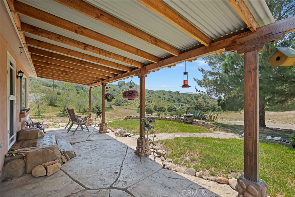 Through the gates and beyond Jonata Springs Ranch, where country living meets the convenience of nearby Buellton—just minutes away. Nestled in gently rolling hills, this charming 2-bedroom, 2-bathroom home with its classic red tile roof boasts its own private well offering a peaceful, self-sustained lifestyle. Just a stone's throw away, a spacious and versatile barn complements the property, all set on 20 picturesque acres—an ideal retreat for horse lovers, hobby farmers, or anyone seeking room to grow and roam. Located just 15 miles from the coast, 15 minutes from Los Olivos, 45 minutes from Santa Barbara, and approximately 2.5 hours from Los Angeles, this property offers the perfect balance of seclusion and accessibility. Whether you're envisioning a family compound or simply a peaceful retreat, there's ample room to stretch out and make it your own. With stunning views and a magical golden hour that bathes the property in warm light each evening, this is truly a must-see.