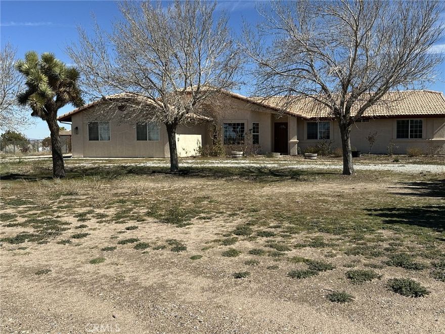 Location! Location! Location! – Spacious Home on 1.5 Acres!
Welcome to wide open spaces just minutes from the I-15 freeway! Located only two city blocks from pavement, this property offers both convenience and country living. Bring your toys, bring your horses, and enjoy all the room you’ve been looking for.
Inside, the great open floor plan features a large family room with a cozy corner fireplace—perfect for gatherings. The kitchen opens to the family room and includes a walk-in pantry for plenty of storage.
This home offers 3 spacious bedrooms, including a main suite with a walk-in closet and a private bath with dual sinks.
Enjoy the outdoors year-round in the enclosed patio filled with natural light, ideal for morning coffee or relaxing evenings.
The property is mostly fenced and includes two additional storage sheds, making it perfect for hobbies, animals, or extra space. All this sits on approximately 1.5 acres in the desirable Great Oak Hills area.