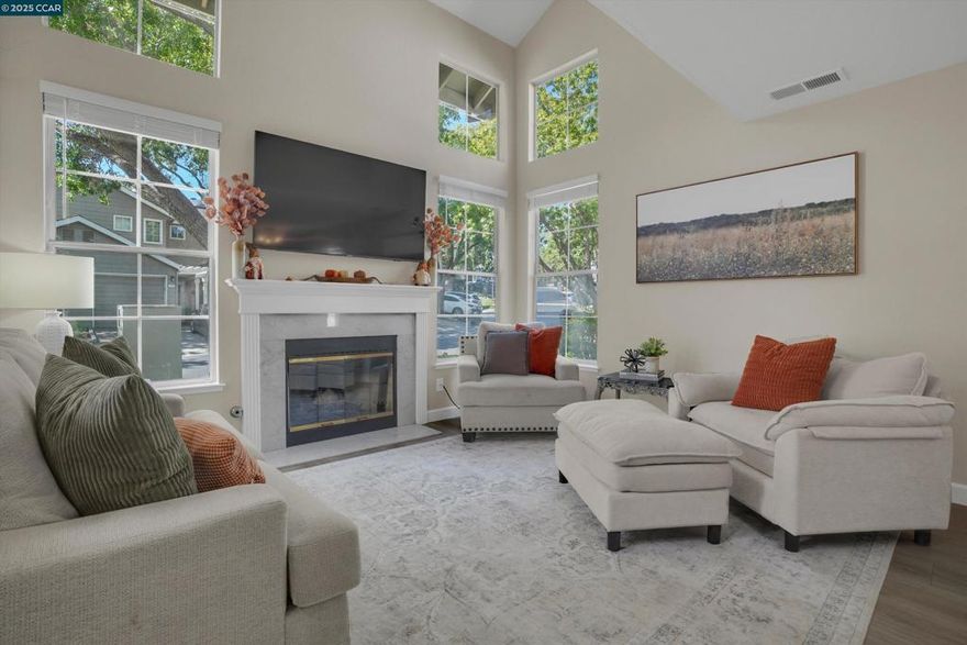 This home qualifies for a free temporary rate buy down and other programs! Discover the perfect blend of comfort and community in this beautifully updated corner-lot townhome in Martinez’s coveted Shadowbrook neighborhood. Natural light pours through vaulted ceilings into the living room, where a cozy fireplace sets the scene for movie nights or evenings with friends. The open layout makes entertaining effortless, share meals in the dining area or morning coffee in the remodeled kitchen, complete with sleek quartz counters, stainless steel appliances, and a sunny breakfast nook. Upstairs, two private bedroom suites each feature their own bathrooms, offering space and privacy for family, guests, or a home office. A convenient half bath on the main level and upstairs laundry add everyday ease. Shadowbrook’s pool, spa, and fitness room invite you to unwind or stay active, while just minutes away you’ll find convenient grocery shopping & highly regarded local schools. Beyond the community, Martinez offers a charming downtown filled with boutiques and trendy restaurants. Spend weekends exploring waterfront parks, hiking trails, or Briones Regional Park, and enjoy year-round farmers markets and festivals. With easy freeway access for Bay Area commutes and a welcoming small-town vibe.