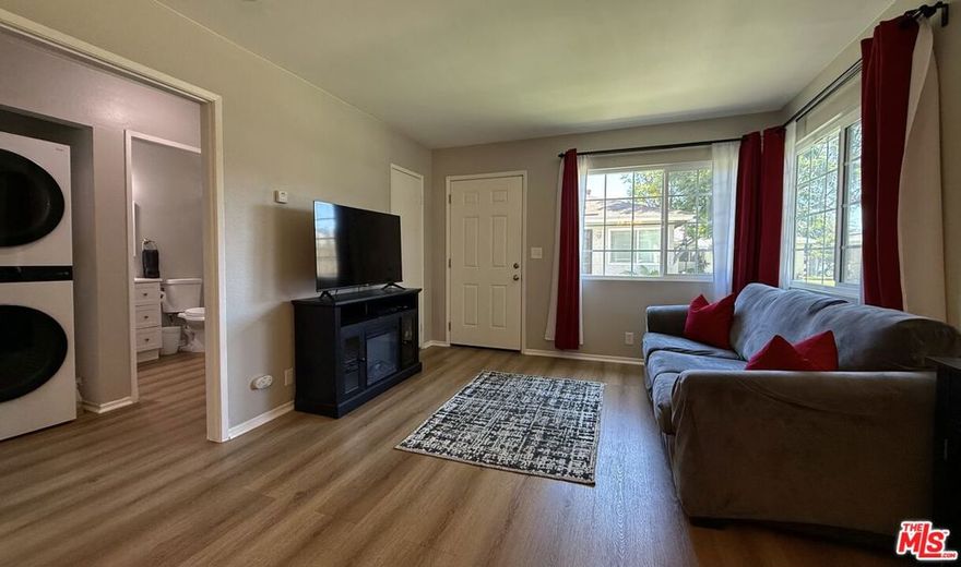 NEWLY RENOVATED 1BR/1BA CONDO IN GATED CARSON COMMUNITY of Avalon Greens! This adorable condo is uniquely designed to feel like a stand alone unit, no neighbors above or below. This gem boasts a completely remodeled kitchen with gorgeous quartz counters, stainless steel appliances & modern finishes. New laminate flooring flows seamlessly through the entire home. Fully renovated bathroom features updated fixtures, sleek finishes & contemporary design. Bonus features includes a separate garage unit perfect for parking or additional storage PLUS one assigned outdoor parking space! Enjoy beautifully landscaped grounds surrounding this completely refreshed unit. Ideal for first-time buyers or savvy investors! Secure gated community offers peace of mind & lush green living. Easy freeway access & close to shopping, dining & entertainment. Move-in ready! Exceptional value!