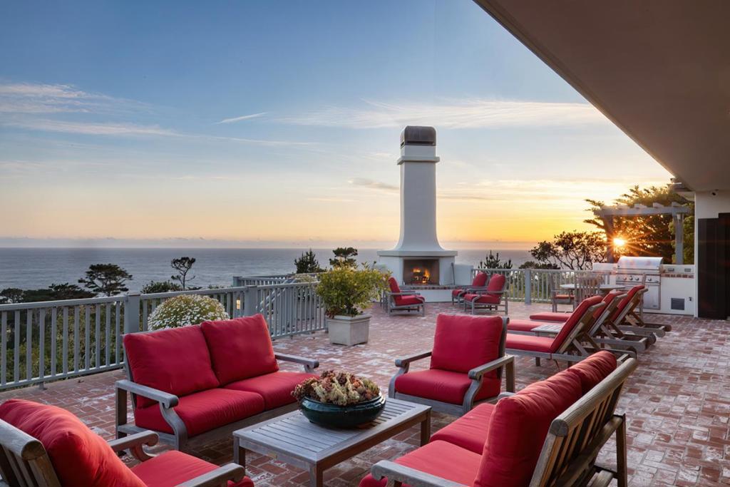 Perched above the Pacific Ocean with commanding water views from Point Sur to Cypress Point, this iconic estate captures the essence of California's most prestigious coastal living community. From the moment you arrive, a sense of grandeur unfolds as floor-to-ceiling glass doors and windows frame cinematic ocean panoramas, and the sophisticated design seamlessly flows throughout the main residence. The gourmet chef's kitchen is designed for functional living and entertaining, and the primary bedroom suite offers a private sanctuary with dual walk-in wardrobes, spa-inspired bath and office. Elegant entertaining and relaxation spaces abound from the living room to the dining and great room, to the expansive ocean view deck with built-in barbecue, outdoor fireplace and the soothing soundtrack of waves crashing below. A separate, fully appointed two-bedroom, two-bath guest house offers luxurious accommodations for visitors or staff. Located on an expansive street-to-street parcel minutes from The Lodge at Pebble Beach, this gated estate is enveloped by professionally curated gardens, mature shrubs and trees, and secure parking for up to ten vehicles. This is much more than a residence - it's a lifestyle steeped in excellence in one of the most treasured locations on the peninsula.