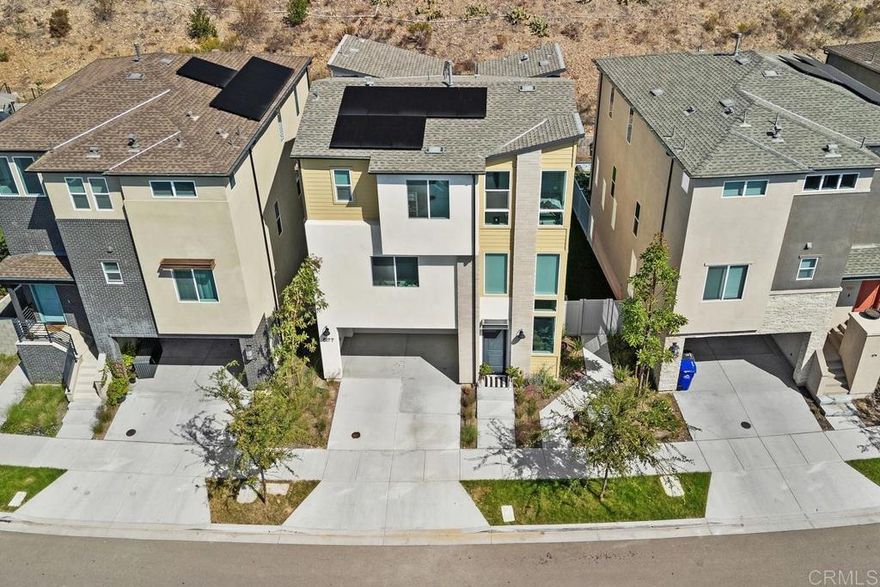 Citrine at 3Roots – Sorrento Mesa: Modern living awaits in this newly constructed Citrine residence, set on a premium-size lot with a view of the canyon hill reserve (open space) within the desirable 3Roots master-planned community. Offering 4 spacious bedrooms, 3.5 baths, and 2,316 sq. ft., the home’s contemporary floor plan is designed for comfort and function. Sun-filled interiors showcase upgraded flooring, quartz countertops, custom cabinetry, and premium stainless steel appliances throughout the chef-inspired kitchen. On the entry level, a versatile suite with an ensuite bath provides the perfect space for guests or a dedicated home office. The second floor opens to expansive living and dining areas, seamlessly connected to a covered balcony—ideal for entertaining or enjoying California’s indoor-outdoor lifestyle. The owner’s suite is a restful retreat featuring a luxurious bath with a soaking tub and a private balcony. Continuing, there are two spacious secondary bedrooms and a full bathroom with a double sink vanity on the same floor. Additional features include a two-car garage and drought-tolerant landscaped grounds. Eco-friendly living with rooftop solar, Smart home technology, integrated air filtration system, providing sustainable energy and long-term savings, and Ring security. Residents of 3Roots enjoy access to an exclusive array of amenities: a cutting-edge fitness center, resort-inspired pool, multiple parks, playgrounds, sports courts, and scenic walking trails throughout the community, reflecting a commitment to wellness and convenience. Perfectly positioned in Sorrento Mesa, this home offers quick access to area beaches, shopping, dining, and major employment centers. Contact today for a private showing and make this exceptional Citrine home your next address in San Diego.