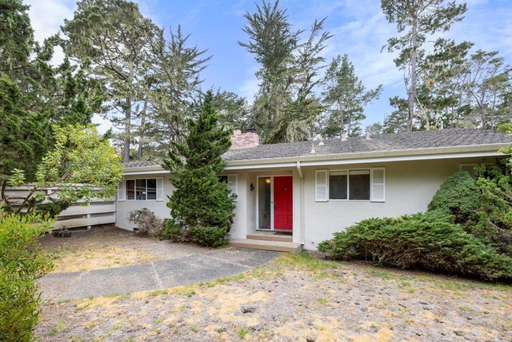 Welcome to this charming 3-bedroom, 2-bathroom home located in picturesque Pebble Beach. With a spacious 1,716 sq ft layout on a generous corner lot. The kitchen features a built-in BBQ grill, electric cooktop, double oven, refrigerator, dishwasher, and tile countertops all perfect for culinary adventures. The dining area boasts both a breakfast bar and a dedicated dining space. Relax in the living room with a cozy fireplace with large window looking to out the forest. The home features a mix of carpet, slate, and tile flooring, combining comfort and style. Convenient in-garage laundry connections. This property is part of the Pacific Grove Unified School District. Additional amenities include central forced air heating and a two-car garage. Enjoy the serene lifestyle Pebble Beach has to offer!
