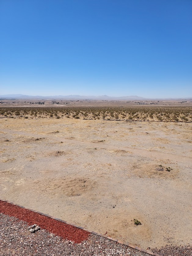 Great vacation & weekend spot for RVing, ATV & ORV, or location for a manufactured home. 5 acre lot in a rectangle layout (300+ yards by 600+), on a hill with amazing views day and night, 20-30 min on HWY from shopping. ATV/ORV rec areas and trails within minutes. Includes 20' cargo container with shelves, counter top, and self contained sink.