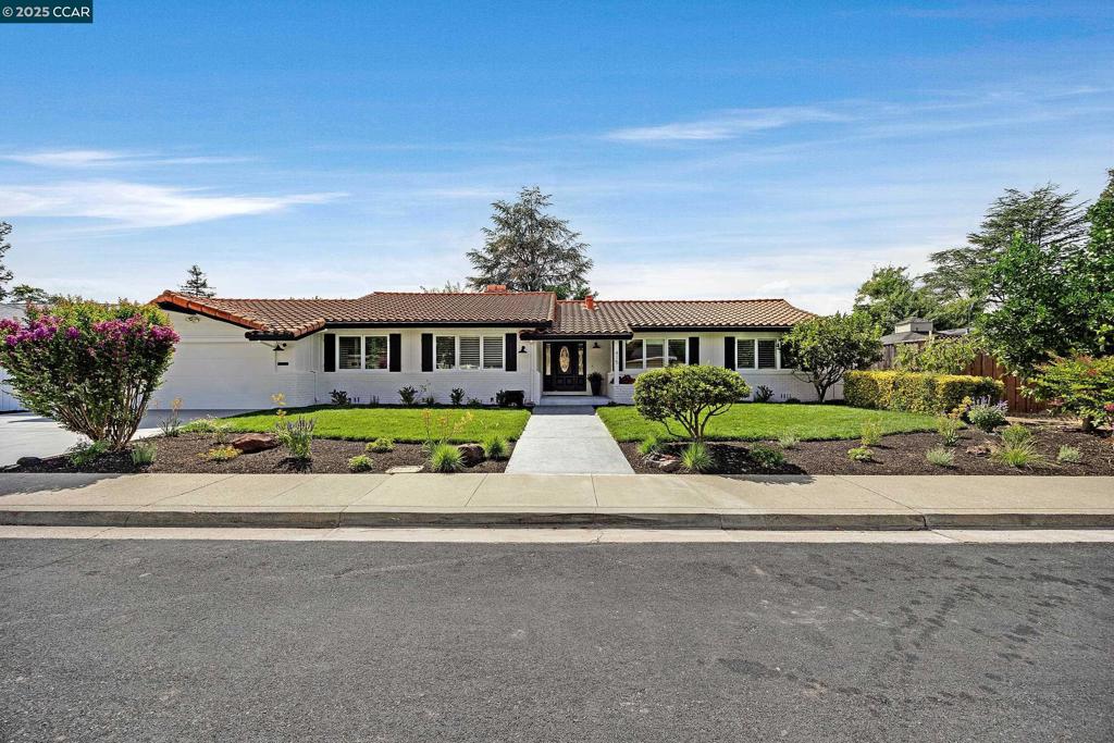This beautifully updated single-story home showcases a modern kitchen, hardwood floors throughout, and stylishly renovated bathrooms. The spacious floorplan includes large bedrooms with an expanded primary suite, offering comfort and flexibility. The large primary suite featuring a nook area with built-in shelving, access to the backyard and an en-suite bathroom is ideal for relaxation. Light and bright interiors are enhanced by recessed lighting, while fresh interior and exterior paint add to the home’s move-in ready appeal. A backyard bonus space of approximately 16.5’ x 11’ with electricity provides the perfect setting for a home office, gym, workshop, or game room. Outside, refreshed landscaping enhances the curb appeal, and the desirable court location offers privacy and a peaceful setting. Relax in the private backyard where mature fruit trees—fig, persimmon, apple, lemon and orange—offer both beauty and bounty. Live close to excellent schools as well as shopping, dining and parks.