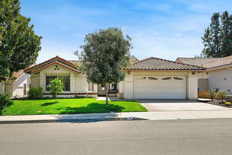 Welcome to 1205 Columbus Way, a spacious single-story home offering 3 bedrooms, 2 full bathrooms, and 2,035 sq. ft. of living space on a generous 6,204 sq. ft. lot. Built in 1985 and recently refreshed with new interior paint and luxury vinyl plank flooring, this home combines some modern updates with a highly desirable Shadowridge location.  Curb appeal shines with lush green landscaping, native trees, and side yard access to the backyard. Golf enthusiasts will love the prime setting along the 7th fairway of Shadowridge Golf Club, where manicured views stretch from the tee box to the green.  Inside, the open floor plan is filled with natural light. The spacious living room features a large picture window overlooking the course, beautiful wood ceiling trim, a cozy fireplace, and a convenient service bar with sink.  The bright kitchen offers abundant counter space, cabinetry, and an eat-in dining nook with direct patio access, complemented by a separate formal dining room.  The private primary suite enjoys backyard views and patio access, plus a spa-like bathroom with dual sinks, soaking tub, separate shower, and a walk-in closet. Two additional bedrooms with new carpet share a full bath with easy-access step in shower. A dedicated laundry room with extra cabinetry sits between the kitchen and attached garage.  Out back, the covered patio and open yard create an inviting space to relax or entertain while taking in panoramic golf course views.  This beautiful home delivers the best of indoor-outdoor living in a peaceful, sought-after neighborhood just minutes from shopping, dining, and schools.