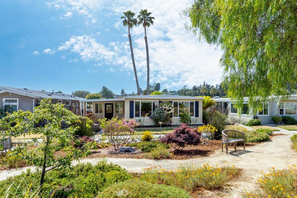 Breathe in the peace and tranquility of this 55+ community on the edge of a redwood forest. Aptos Knolls, a Resident-Owned mobile home park, is one of the most sought after in Santa Cruz County. Residents enjoy access to a beautiful clubhouse with an adjacent pool and hot tub. Only a 5 minute drive to the beach and a 5 minute walk to Nisene Marks State Park, stores, coffee shops and restaurants. This home has been lovingly cared for with many upgrades over the years including dual pane windows, skylights, crown molding, updated tile bathrooms and a lovely plank flooring throughout the home. Bonus room (10'x30') not included in the square footage ! Come and see why this beautiful park ranks among the top choices for retirement living in Aptos.