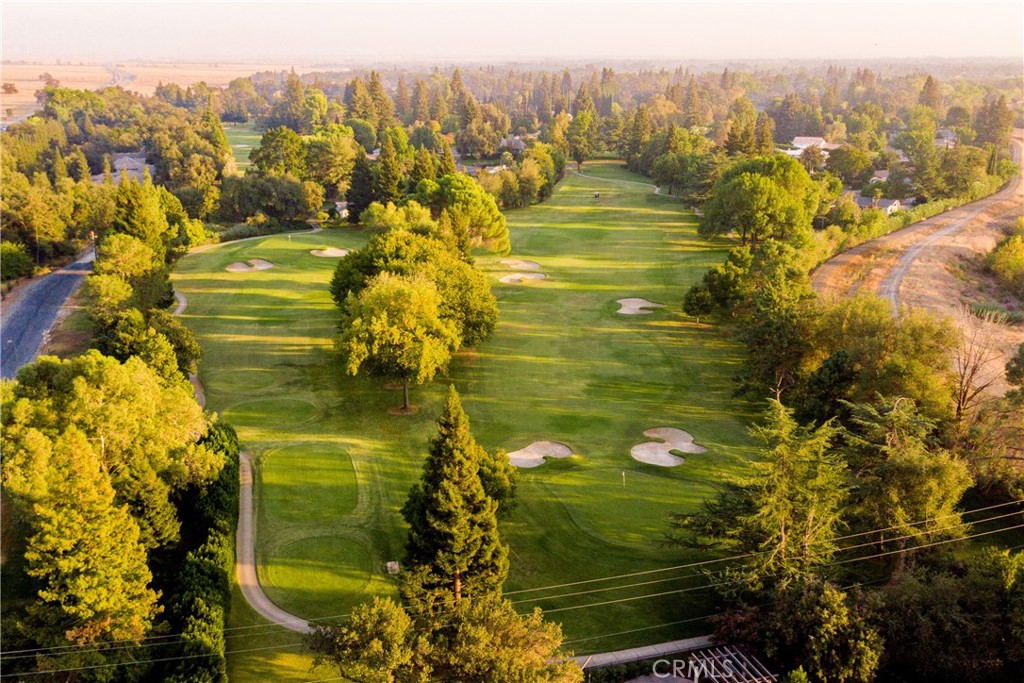 Golf Course lot for just $75k! Craft Your Ideal Home on a .29-Acre Lot in Chico’s Butte Creek Country Club! Here’s your chance to create something special in one of Chico’s most sought-after neighborhoods. This spacious .29-acre lot is tucked inside the gates of the beautiful Butte Creek Country Club community—offering privacy, serenity, and access to one of the region’s premier golf courses.Surrounded by custom-built homes, mature trees, and peaceful views, this flat, build-ready parcel gives you the flexibility to design a home that fits your lifestyle—whether that’s a modern single-level or something a bit more grand. With utilities available at the street and a quiet cul-de-sac location, this lot is ideal for anyone looking to invest in a high-end neighborhood with no through traffic. If you choose to be a member you'll enjoy the perks of country club living, with golf, dining, and social events just moments from your future front door—all while being only minutes from downtown Chico, top-rated schools, and shopping.