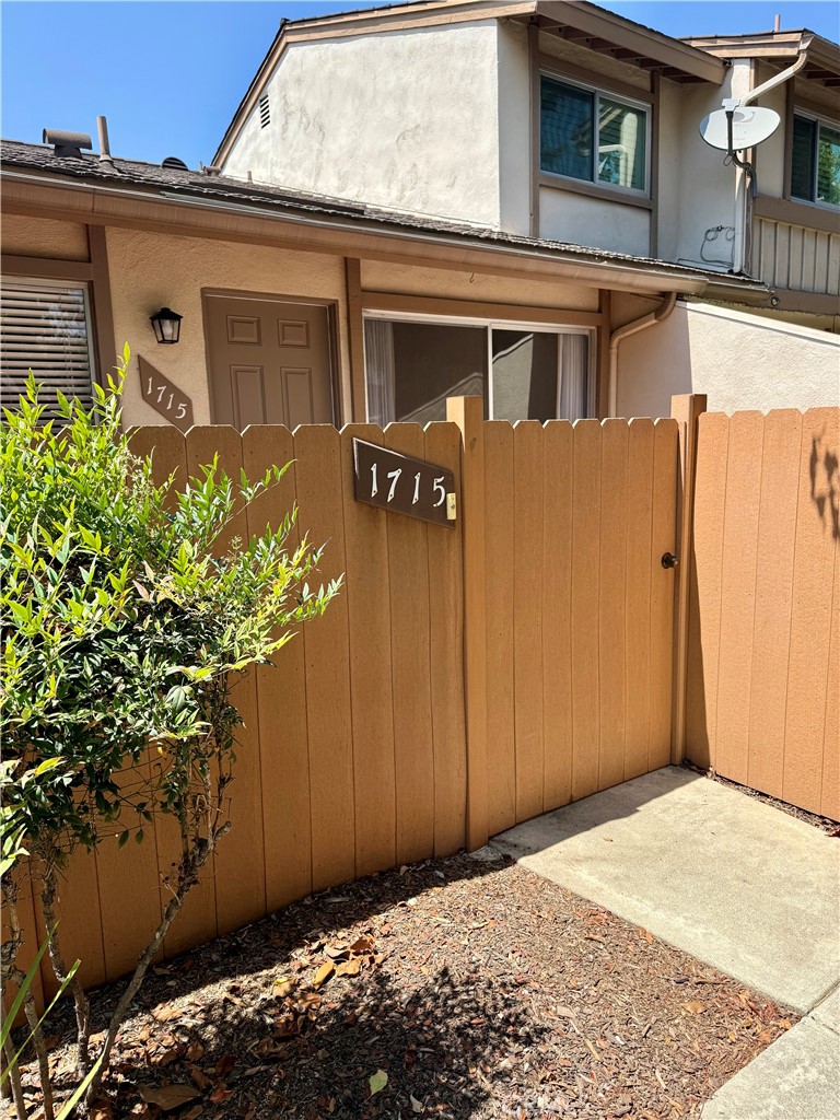 Welcome to 1715 N. Gilbert Street, nestled in the highly sought after Amberwood community. This stunning condo has been completely upgraded with modern finishes and thoughtful details throughout. As you step through your private courtyard and enter the home, you’re greeted by a spacious living room with high ceilings, gorgeous new wood flooring, fresh neutral paint, and elegant window treatments. A sliding glass door opens to the spacious private patio, perfect for relaxing, entertaining, or enjoying the outdoors. Beautifully remodeled kitchen features custom white cabinetry offering plenty of storage, sleek quartz countertops, and stainless steel appliances. A remodeled downstairs guest bathroom showcases a new vanity, updated fixtures, and designer lighting. As you go upstairs, you’ll find brand new carpet and new wood flooring throughout. Spacious primary bedroom with a generous walk-in closet. The secondary bedroom is equally impressive with sliding closet doors. The upstairs full bathroom has been tastefully renovated with all new vanity, fixtures and finishes. Additional highlights include a two car attached garage with laundry area and plenty of extra storage space. Enjoy 2 community pools, spas & clubhouse. Award winning schools * Sunset Lane Elementary, Parks Junior & Sunny Hills High School. Very convenient location, close to Amerige Heights Shopping Center, restaurants, Ralph Clark Regional Park, and much more!