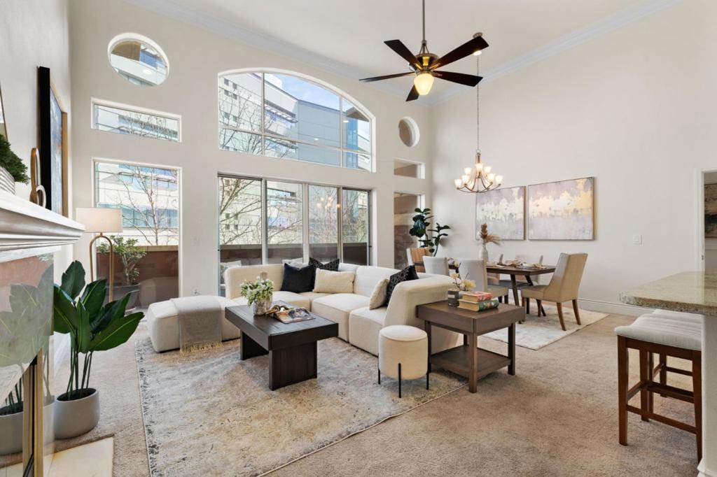 This luxury condo has been completely remodeled and has it all. Top floor, penthouse unit. Vaulted ceilings with large windows and tons of natural sunlight. 2 bedrooms, 2 full bathrooms, and a dedicated office. Gorgeous chef's kitchen with stainless steel appliances and granite counters. Custom kitchen cabinets with soft-close doors, pull-out drawers, and lots of pantry space. Extended kitchen peninsula for extra counter space. Huge primary bedroom suite with large walk-in closet. Amazing spa-like primary bath retreat with custom stall shower and huge luxury Kalia 3 designer square tub. Soak your worries away! Fully functioning home office that has been wired for networking and has tons of cabinet space. Home has been completely wired for Control4 smart home and audio-visual capabilities for the absolute best home entertainment. Recessed lighting throughout and ceiling fans in living room and bedrooms. Terrific top floor location with city and foothill views. Outdoor balcony. Includes 2 parking spaces and additional storage. Great location with restaurants and theaters right outside your doorstep. Easy walk to SJSU, San Pedro Square, SAP Center, and more.