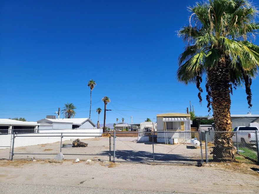 Come and view this quaint mobile home on land in Salton Sea Beach.  With a fully fenced lot and attached patio, enjoying the sunrise over the Santa Rosa Mountains are any outdoor-lover's delight.  This mid-century Skyline manufactured home features an open kitchenette living room combo.