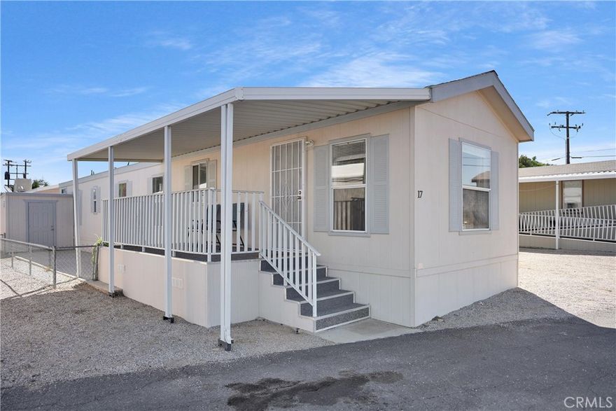 Beautiful Manufactured Home situated in Vali-Hi Home Park! Step into this spacious and well-maintained home built in 2005, offering 3 bedrooms and 2 full bathrooms. The inviting open-concept layout seamlessly connects the kitchen and family room, creating the perfect space for entertaining or family gatherings. Inside, you’ll find laminate wood flooring in the main living areas for a modern touch, while the bedrooms feature cozy carpet for added comfort. The home is exceptionally clean, bright, and move-in ready. Located in a desirable mobile home community, residents enjoy access to a sparkling community pool and beautifully maintained common areas the perfect spot to relax and unwind. This home combines comfort, style, and convenience — a true must-see!