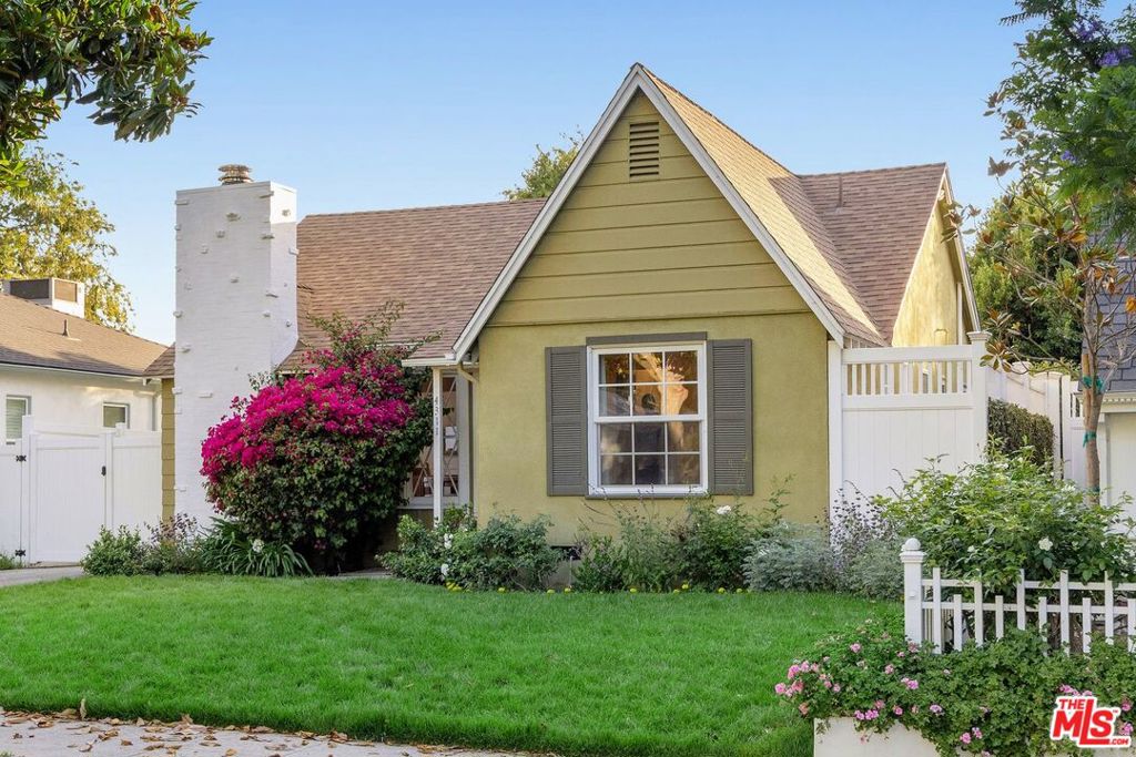 Storybook charm meets unparalleled location in this beautiful English cottage style residence nestled on a tree-lined block just seconds away from Ventura Blvd, and one street over from top-rated Dixie Canyon Elementary School. Glossy hardwood floors, coved ceilings, a brick fireplace surrounded by built-ins, and diamond-paned windows accent the character-rich living room space that flows into a formal dining room and the open kitchen. Hall closets for linens, laundry and storage add functionality to the interior living space. Two guest bedrooms and a guest bath reside off a front hallway, while the recently renovated primary suite with spa-like bath opens out to the back patio and yard that's surrounded by towering greenery for ultimate privacy. The detached garage is finished as a bonus space with drywall, recessed lights, and AC unit, but could also offer full ADU conversion possibilities. The long driveway provides privacy and lots of off-street parking. Truly a special and unique offering in a fabulous location!