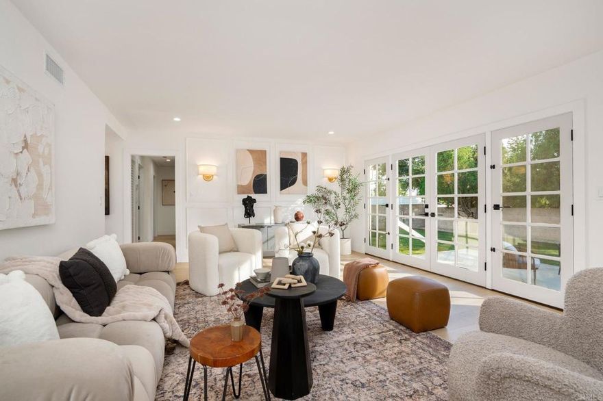 Welcome to this beautifully reimagined Porter Ranch residence, where modern design meets effortless indoor-outdoor living. Thoughtfully remodeled from top to bottom, this move-in-ready home offers refined finishes, abundant natural light, and a layout designed for both everyday comfort and memorable entertaining. The home welcomes you with new flooring and windows throughout, and a light, bright, cohesive aesthetic. The living room feels warm and captivating, framed by large French doors that open to the backyard, creating an ideal setting for entertaining or unwinding. The kitchen has been completely reimagined with new cabinetry, sleek countertops, a fresh backsplash, and all-new appliances, anchored by a spacious island that connects to the dining area and adjacent living spaces.  Retreat to the primary bedroom, where sleek finishes, ample light, and a spa-inspired en suite bath create a peaceful sanctuary. With three additional bedrooms, there is plenty of room for family, friends, or a home office. The secondary bathroom echoes the home’s refined design with modern fixtures and finishes.  Step outside to a private backyard with a concrete patio, surrounded by landscaped grounds, ideal for outdoor dining and entertaining. A detached garage adds valuable functionality and storage.  Set in a quiet residential neighborhood, the home is close to hiking trails, shopping, dining, and commuter routes. Community amenities nearby offer an active, convenient lifestyle while maintaining the charm and tranquility Porter Ranch is known for. Opportunities like this don’t come often. Schedule your private tour today.