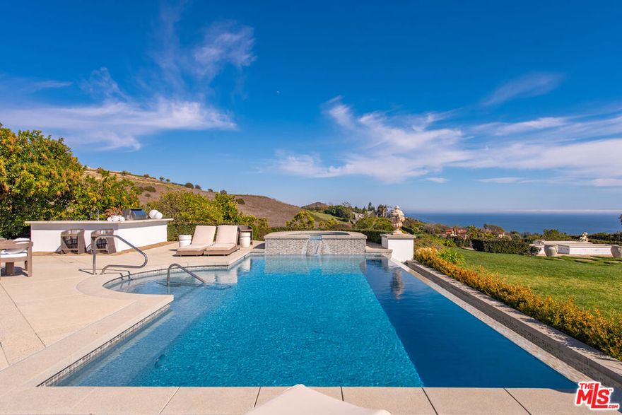 Perched behind gates on a private knoll along Malibu's prestigious hillside, Villa Victoria offers unobstructed ocean views, breathtaking sunsets, and an exquisite blend of cutting-edge technology and timeless coastal elegance. Moments from Paradise Cove, Point Dume, and iconic destinations such as Nobu, Geoffrey's, and Little Beach House, this estate delivers ultimate serenity with direct access to nearby beaches, hiking trails and the cascading Escondido Falls.Blending Mediterranean architecture with seamless indoor-outdoor living, the estate features soaring beamed ceilings, carved stone mantelpieces, French doors, and floor-to-ceiling windows framing the Pacific Ocean and Catalina Island. The open-concept design connects the living room, family room with fireplace, and a chef's kitchen to the expansive pool terrace, outdoor kitchen, dining areas, and day-and-night lit infinity pool with jacuzzi perfect for entertaining under the Malibu stars.The primary suite is a peaceful retreat, offering a fireplace, spa-inspired bathroom, generous walk-in closet, and a private wraparound deck with panoramic views. Five additional en-suite bedrooms, including a versatile study/library, provide elegant accommodations. Exceptional amenities include a fully equipped gym with Peloton, a luxurious home theater, and entertainment room with wet bar. Villa Victoria is a fully integrated smart home featuring a Control4 system managing lighting, security, heating, entertainment, and pool functions. High-speed Frontier fiber optics, dual Starlink satellite systems, indoor-outdoor Wi-Fi extenders, a SONOS integrated music system, motorized shades, Alexa voice assistants, and a dedicated server rack ensure seamless connectivity and convenience throughout. Climate control is optimized with NEST Learning Thermostats on each level.  Wildfire protection includes early detection via Iridium satellite, high-pressure roof sprinklers, Rainbird perimeter irrigation, a 100-gallon fire retardant tank, and pool-fed backup water systems. Solar-powered dusk-to-dawn floodlights and smart air quality monitoring further enhance estate safety.Accessibility features include ADA-compliant design, a sleek pneumatic vacuum elevator, and an Acorn stairlift. The private motor court accommodates up to 50 vehicles, offering ample event hosting opportunities. Sustainability meets luxury with hidden roof-mounted solar panels, four Tesla Power walls, and a Generac backup generator, creating a self-sustaining micro-grid. The grounds include a lush English garden, organic fruit and vegetable plots, and a chicken coop providing fresh eggs daily.  Just minutes away are world-class dining, shopping, and Pepperdine University's campus, as well as hiking and outdoor adventures through the Santa Monica Mountains.A true legacy estate, Villa Victoria embodies coastal serenity, innovative luxury, and timeless beauty and unparalleled offering in the heart of Malibu.