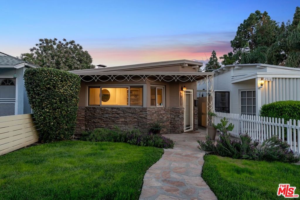 *Seller is offering a buy down for the Buyer at close of escrow* Welcome to 2914 W Chandler Boulevard, a charming bungalow in the heart of Burbank's desirable Magnolia Park neighborhood. Built in 1947, this 1,071 sq ft single-story home blends timeless character with thoughtful modern updates.Inside, exposed dark wood ceilings, a cozy fireplace, and durable vinyl flooring create a warm and inviting living space. The updated kitchen offers generous counter space and storage for culinary endeavors. A versatile flex space at the rear of the home provides endless possibilities ideal for a home office, gym, creative studio, or guest area. Recent landscaping upgrades enhance the curb appeal, while the backyard has been transformed into a private oasis perfect for entertaining or relaxing. The covered patio, lush greenery, and ample space for outdoor activities make it a true retreat.Located directly across from the Chandler Bike Path and just 1.9 miles from the renowned Burbank Studios, this home offers unparalleled access to local cafes, shops, and entertainment. Additional highlights include central heating and cooling, an in-carport laundry area, and a 3,375 sq ft lot.Move-in ready and brimming with character, this property presents a rare opportunity to own in one of Burbank's most sought-after neighborhoods.