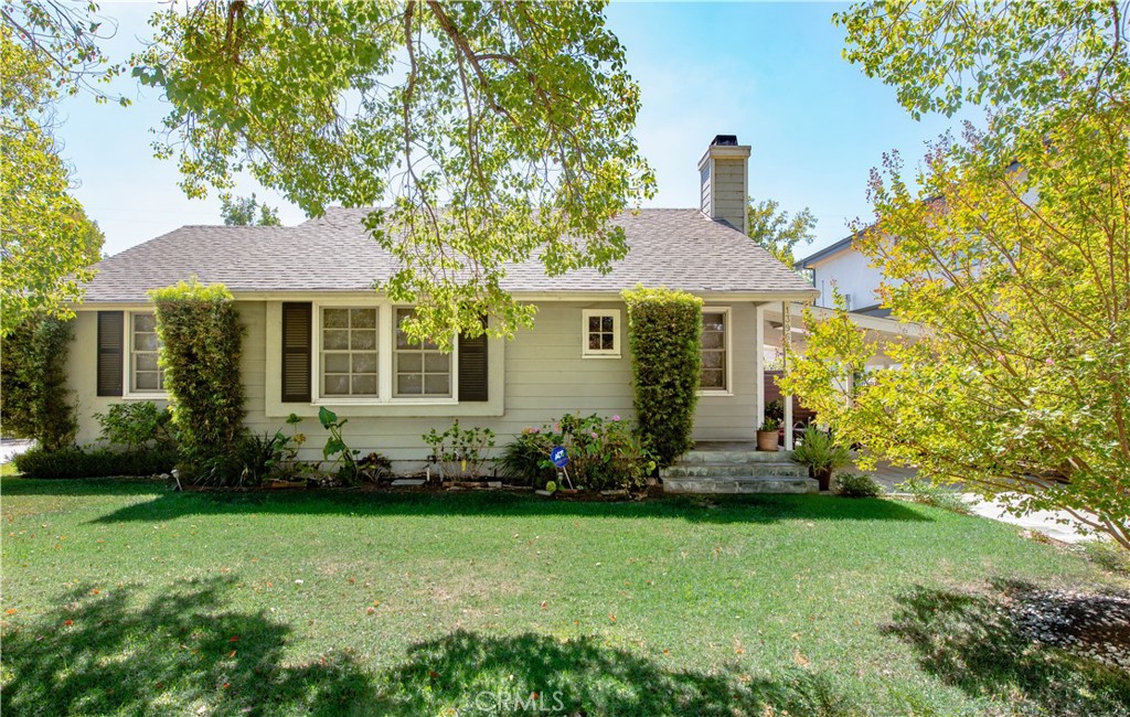 Nestled on a charming tree-lined street in the highly desirable Fashion Square neighborhood, this beautifully updated residence offers a rare blend of character, functionality, and resort-style living. The property features a 3-bedroom, 2-bath main house (1592 sq/ft) PLUS a detached casitas/ studio/rec room (approx. 500 sq/ft) with its own bath, perfect for guests, a home office, or creative space.
Step inside to discover a light-filled open floor plan enhanced by brand new interior paint, gleaming wood floors, abundant windows, recessed lighting, and a cozy fireplace. The impressive remodeled kitchen boasts custom cabinetry, granite counters, stainless steel appliances, and a breakfast bar, seamlessly connecting to the vaulted-ceiling dining area with serene views of the pool. An oversized walk-in pantry sits conveniently adjacent in the laundry room. The spacious primary suite is a true retreat, complete with both a wardrobe and walk-in closet, vaulted ceilings, sitting area, and a luxurious bath featuring granite counters, a jetted tub, and a frameless glass rain shower. Outside, the backyard feels like a private getaway with multiple lounging and dining areas surrounding the sparkling pool and spa. The detached casitas/rec room offers high ceilings, a private entrance, and its own full bath, providing incredible versatility.
Additional upgrades include a tankless water heater, copper plumbing, newer windows, and upgraded electrical. All this just moments from Westfield Mall, Trader Joe’s, Hazeltine Park, and award-winning schools—making this home as convenient as it is captivating.