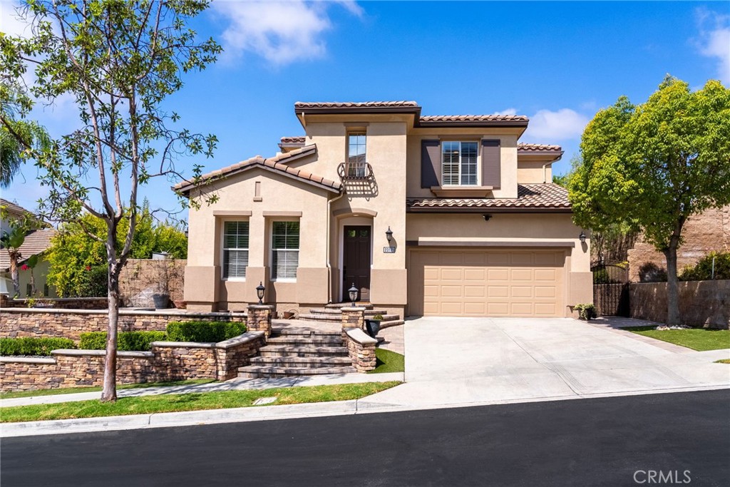 Welcome to 23171 Rockrose, an exquisitely reimagined home tucked away on a desirable single-loaded street in the guard-gated enclave of Stoneridge, Mission Viejo. Beyond its stunning curb appeal, this residence offers exclusive Lake Mission Viejo privileges — from boating and fishing to private sandy beaches.
Inside, soaring ceilings set the stage for a home that feels both grand and inviting. Nearly every corner has been refreshed with brand-new upgrades: new PEX plumbing, new lighting, new flooring, new luxurious interior paint, a new HVAC system, new epoxy-finished garage floors, and a new hot water tank. Plantation shutters and custom millwork — including wainscoting, archways, and crown molding — bring warmth and timeless elegance.
The gourmet kitchen is a showstopper, outfitted with granite countertops, a spacious breakfast bar, and premium appliances: built-in SUB-ZERO refrigerator, WOLF double oven, and a new WOLF island range. Upstairs, the expansive primary suite is a private retreat, featuring a spa-inspired bath with travertine stone and designer finishes. Each additional bathroom has also been thoughtfully updated with custom mirrors and curated details.
Outdoors, enjoy low-maintenance beauty with lush artificial turf, custom pavers, and stacked-stone planter boxes. A whole-house fan keeps the home energy efficient, while the 3-car tandem garage offers generous storage.
With no neighbors directly across the street, top-rated schools nearby, shopping, dining, golf, La Paws Dog Park, the Nadadores Swim Facility, low HOA dues, and no Mello Roos, this home delivers the very best of Southern California living.
Don’t miss your chance to experience this rare find on one of Stoneridge’s premier streets — schedule your private tour today!