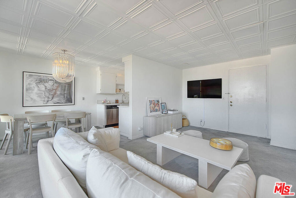Live the Los Angeles lifestyle in this beautifully designed, French-inspired, top-floor, front-facing unit located just two blocks from vibrant Melrose Avenue in the sought-after Hancock Park area. This light-filled 1-bedroom, 1-bathroom residence offers exceptional privacy with only one shared wall and showcases elegant French doors that open into a spacious primary suite with a generous walk-in closet.Enjoy picturesque views from your private balcony, including glimpses of Downtown Los Angeles and the iconic Hollywood Sign. The well-appointed floor plan provides excellent flow, natural light, and classic architectural charm.Additional features include: Two reserved tandem parking spaces in a secure, gated garage Washer/dryer hookup potential with HOA approval Top-floor location with minimal shared walls. Residents enjoy access to community amenities such as a heated pool, sauna, fitness area, on-site laundry facilities, and a controlled-access entry system for added peace of mind.Ideally situated near West Hollywood, The Grove, LACMA, Runyon Canyon, the Original Farmers Market, and the Hollywood Bowl, this home offers unparalleled walkability to world-class dining, shopping, and entertainment.