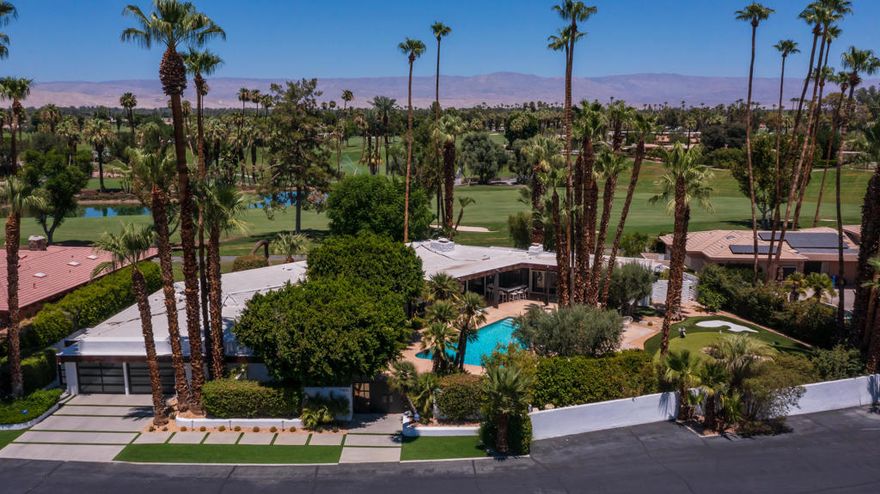 Set on the 9th Fairway of the legendary Thunderbird Country Club in Rancho Mirage, this extraordinary residence combines architectural pedigree with modern luxury. Originally designed by renowned architect William Cody, the home was fully reimagined in 2018 with a comprehensive remodel that preserved its timeless mid-century character while introducing contemporary elegance.Offering 4+ bedrooms, 4,344 square feet including an attached casita with exterior entrances, and a versatile floor plan, the home is ideal for both intimate living and grand-scale entertaining. Expansive walls of glass capture breathtaking mountain and fairway views, blurring the line between indoors and out. The open-concept living spaces are anchored by sleek finishes and abundant natural light, creating a sense of warmth and refinement throughout.The entry courtyard has a pool/spa and covered patio area that includes a built-in bar with BBQ, plenty of space for outdoor living and dining, and a putting green and sand bunker. Two luxurious primary bedroom suites provide comfort and privacy, while the updated bathrooms reflect modern design and sophistication.Outdoors, multiple terraces, the pool and lounge areas invite relaxation against the backdrop of Thunderbird's lush fairways and dramatic desert mountains. This is an exceptionally rare opportunity to own a Cody-designed home within one of the Coachella Valley's most prestigious and historic clubs, where architecture, lifestyle, and setting converge perfectly.