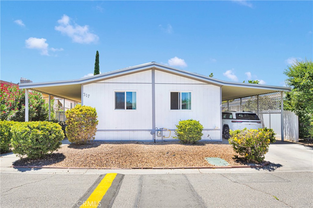 Beautiful and spacious 3 bedroom, 2 bathroom manufactured home located in the desirable all-ages Gold West Mobile Home Park. This home features vaulted ceilings, a skylight in the kitchen for natural light, and an open floor plan with the kitchen opening onto the living room. The large primary suite includes a garden tub. Additional features include a separate laundry room with direct access to the covered carport and a storage shed. Recent updates include newer carpet, newer flooring, roof and exterior paint only a year old. Community amenities include gated access with paid security, two swimming pools, spa, tennis courts, basketball courts, fitness center, and a large clubhouse with an event room and kitchen. Conveniently located near freeways, shopping centers, and schools. Buyer to verify all information. All buyers must be approved by the park prior to purchase.