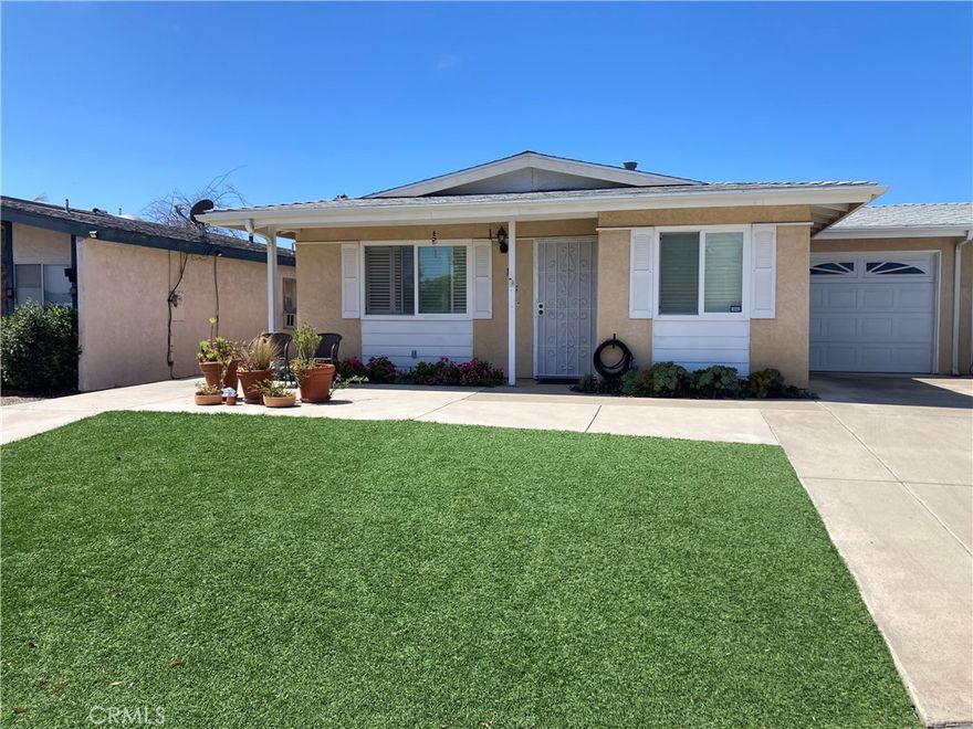 Welcome to this well-maintained home in a desirable 55+ community, where you’ll enjoy the privacy of no shared walls (except in the garage) and the comfort of thoughtful accessibility features, including safety rails and a walk-in shower. This home offers spacious living with a large master bedroom and en-suite bath, a bright kitchen with a gas range, cozy nook, and included refrigerator, the convenience of an indoor laundry with washer and dryer included. Also featuring updates such as a newer roof and newer water heater. Enjoy outdoor living with an artificial front lawn, sliding glass door to a large covered patio, and a quiet, low-maintenance yard. Residents also have access to a private community park, perfect for peaceful walks or socializing with neighbors. This clean, move-in ready home also comes with a single-car garage. No HOA fees!