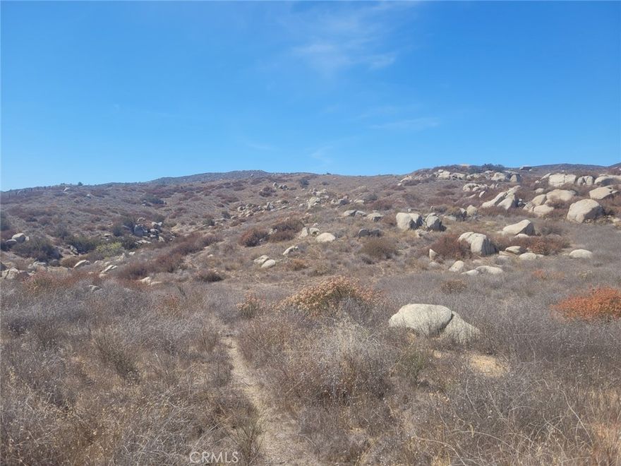 20 acre parcel with spectacular views, decent access and what seems to be a great potential home site. Minutes from shopping, schools etc but super private and serene, partially fenced. Bring your imagination!!!