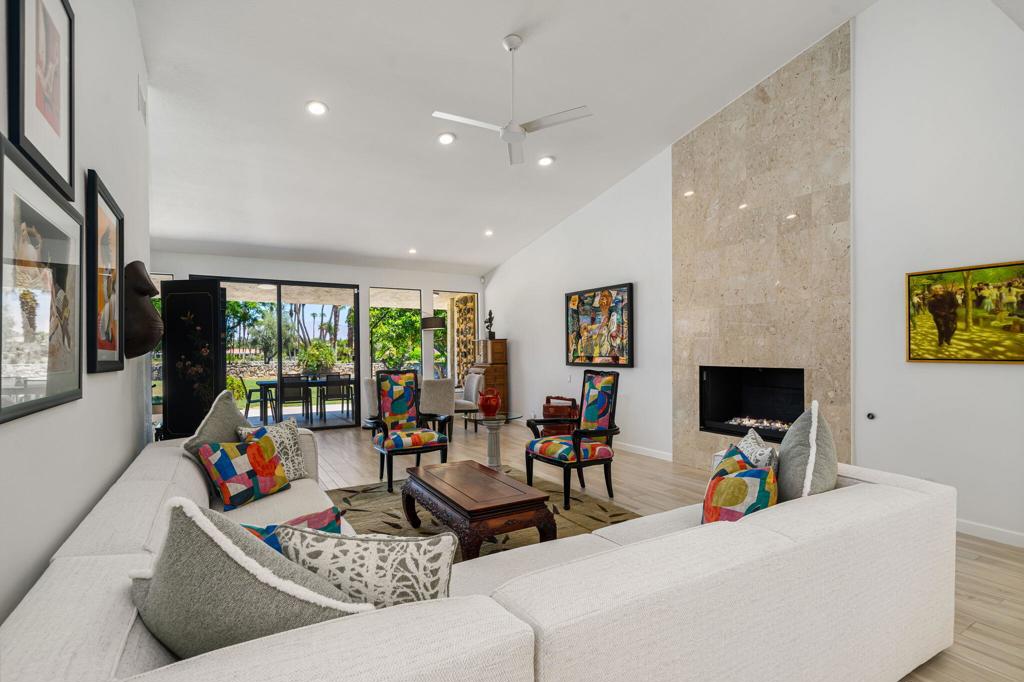 Discover elevated desert living in this beautifully reimagined home at Desert Horizons Country Club, one of Indian Wells' most prestigious communities. Thoughtfully designed for both comfort and sophistication, this 3-bedroom, 3.5-bath residence spans over 3,000 sq. ft. and showcases light-filled interiors with views of the golf course, tranquil lake, and surrounding mountains.A gracious double-door entry opens to a spacious living room with walls of glass that invite the outdoors in. The gourmet kitchen flows seamlessly into a cozy den, creating the perfect setting for everyday living or casual gatherings with family and friends.The expanded primary suite serves as a private retreat, featuring a versatile flex area perfect for a home office or fitness studio, generous walk-in closets with custom built-ins, and a spa-inspired bath. Guests are well cared for in the ensuite guest bedroom with serene courtyard and mountain views, while the second guest room has been transformed into a practical home office with dual workstations and custom cabinetry.Additional upgrades include Italian porcelain tile floors, new bedroom carpeting, a remodeled powder bath, fresh interior paint, updated lighting and fixtures, and significant system improvements such as dual 4-ton AC units, a newer water heater, epoxy-finished garage floors and a leased solar system for enhanced energy efficiency.Residents enjoy the recently completed clubhouse, a desert-modern showpiece offering a full-service restaurant and bar, casual cafe, 8,000 sq. ft. wellness center, pro shop and a courts pavilion with 11 pickleball and 2 tennis courts. Here, resort-caliber amenities meet timeless desert elegance--just minutes from world-class dining, shopping, and events in the heart of Indian Wells. Schedule your private showing today.