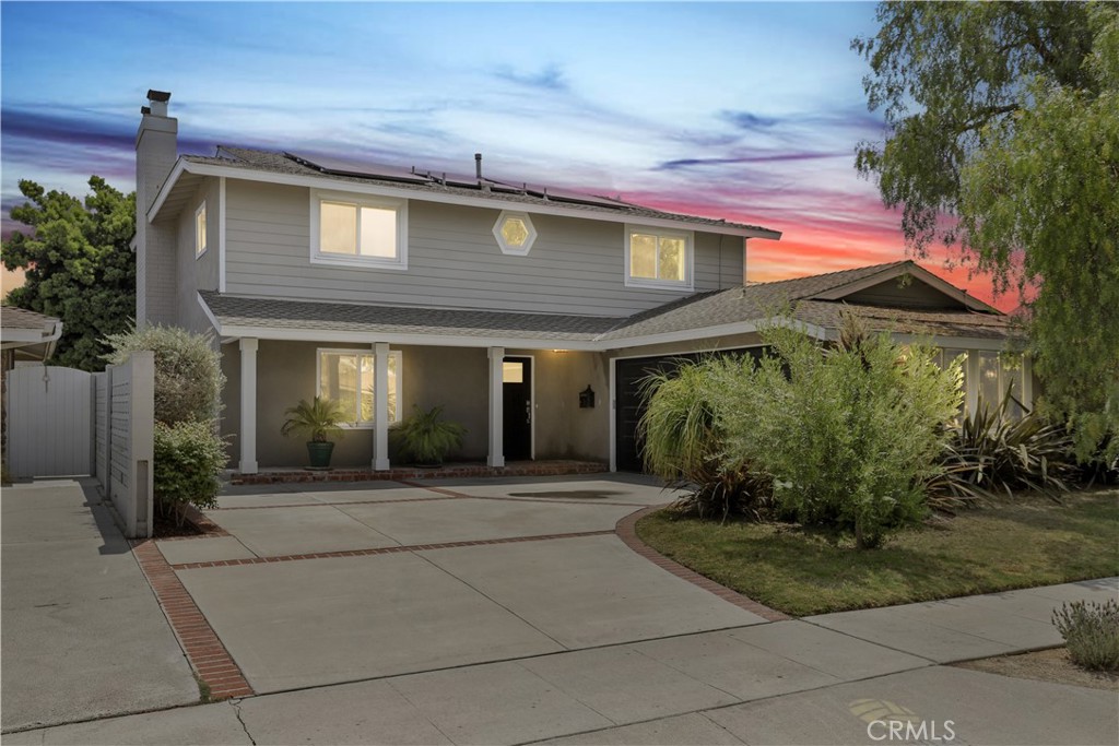 Beautifully updated 5 bed, 3 bath home located in the El Dorado Park neighborhood of Long Beach! Offering Solar Panels, an open and spacious interior featuring recessed lights, dual pane windows, and central A/C. The formal entry opens to the living area with fireplace featuring quartz as well as lots of natural light through the large picture window and the sliding glass door to the backyard. The dining area also has a slider to the backyard and sits just off of the remodeled kitchen that offers quartz counters, white cabinetry, tile backsplash and stainless steel appliances! There is also a separate family room area that sits on the opposite side of the kitchen with a built in buffet and a slider to the side yard. A bedroom and updated bathroom with walk-in shower complete the main floor. Upstairs you are greeted with 4 more generously sized bedrooms including the huge main bedroom with remodeled private ensuite that has a large walk-in shower and 2 shower heads, including a rainfall shower head. There is also an updated full-size hall bathroom with shower/tub combo and dual sink vanity for the secondary bedrooms to share. Relax and entertain in the private backyard with block wall fencing, and mature trees that provide shade. This home also has an attached 2-car garage as well as driveway parking. Conveniently located near El Dorado Park, schools, shopping, dining, and 605 Fwy Access. Schedule your private tour today!
