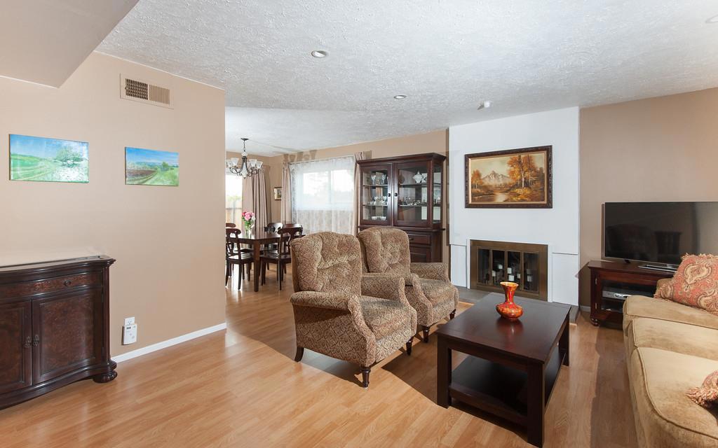 Welcome into this beautiful well maintained open floor plan, single. Featuring central air conditioning, dual pane windows, pergo floors, recessed lighting, spacious kitchen including appliances, separate dining and living room with cozy wood burning fireplace, 3 bedrooms 1 1/2 baths, indoor laundry room and attached two car garage. You and your family will enjoy your corner of paradise while entertaining in your spacious private back yard. Located in desireable, sought after Walnut Valley School District.