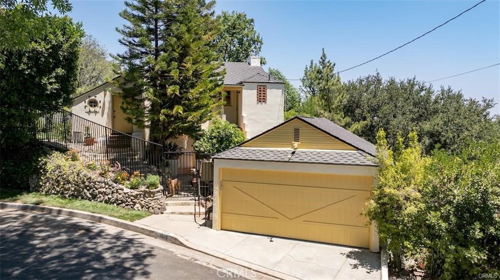 Rare once-in-a-century opportunity to acquire a one-family-owned, 100-year-old classic — a gorgeous, character-filled Spanish home with sweeping valley views. Set on a 10,000 sq ft lot, the property boasts a commanding 100 feet of street frontage and two very secluded backyards and a set of huge private side yards for ultimate privacy. One of the rear yards offers a number of Runyon Canyon-like meandering paths set under 100-year-old oaks and other mature landscape, while the other features a great grassy play area, ideal for a future pool. Despite being one of the first homes built in Sherman Oaks, it has been thoroughly — yet sensitively — modernized. It now features new systems (including roof, sewer line, AC, etc.) and has undergone a complete remodel that retains all its original character and joy, but now beautifully repositioned for a new millennium. The main public rooms include a formal entry, formal living and dining rooms, a large den, and an expansive, light-filled kitchen. The spacious living room includes a fireplace, vaulted stenciled beamed ceilings, built-in shelving, and both a stained-glass vintage bay window and an oversized, arch-topped Palladian-style window. The paneled den offers sweeping views across nearly the entire valley, while the formal dining room opens to a view-facing balcony. The kitchen features a bay window and is appointed with bespoke custom cabinetry, marble countertops, vintage-style tile, and modern appliances — except for the original stove! — along with a charming separate pantry and back entrance. The bathrooms have been completely redone, carefully styled to reflect the home’s original character. The bedrooms are en-suite, offering views and deck access, with the primary suite including a view-facing clawfoot soaking tub. Natural light abounds throughout the home, gleaming off the original (refinished!) 100-year-old oak floors. The ceilings are coffered downstairs and vaulted upstairs with original stenciled beams. Other old-world features include vintage light fixtures, glass knobs, and original stained glass doors and windows — all combining to make this one of the most charming and unique homes south of the Boulevard. A home like this only comes around once in a hundred years!