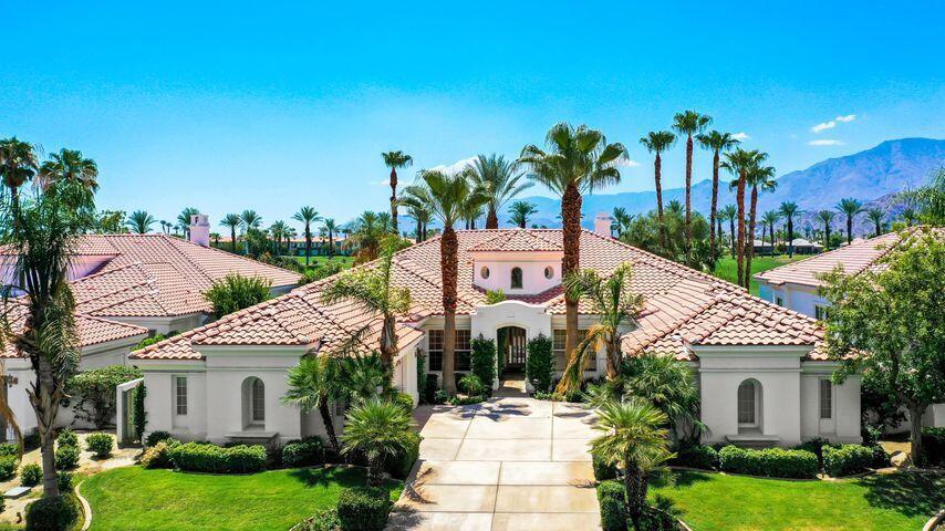 Golf Transfer available* Panoramic southern mountain views across two fairways. This dramatic, 4-bedroom Ventana home is in La Quinta's Mountain View Country Club on the Arnold Palmer Signature course. It boasts a private casita, a large private office and media room. The courtyard entry leads you into a soaring 18', skylit rotunda foyer that opens up to BIG -- a big 43' Great Room, a big 17' Office/Den, a big 35' Master Suite -- over 4400 sf. of spacious luxury. Guests?...a courtyard casita plus two guest rooms with their own sitting room (or media room or family room). The Great Room with its bow-window dining room captures the view and is perfect for entertaining. Outside the lush landscaping and custom pool extend the entertaining and frame the view. The feature list is endless - dramatic 12' soffited ceilings, 8' doors, gourmet kitchen with European-style maple cabinets, slab granite counters, convection oven and built-in refrigerator; Roman tub and separate shower in master bath, recirculating hot water, switch-start fireplace, etc, etc, etc. The newly remodeled clubhouse hosts a wide variety of social events, dining areas and lounges. The fitness & aquatic center incorporates state-of-the-art equipment, aerobics and Pilates room, personal trainers and classes. The showers, saunas, steam rooms, saunas and whirlpool complement the day spa. Outside facilities include tennis courts, pickle ball, bocce ball and a resort-style heated pool.